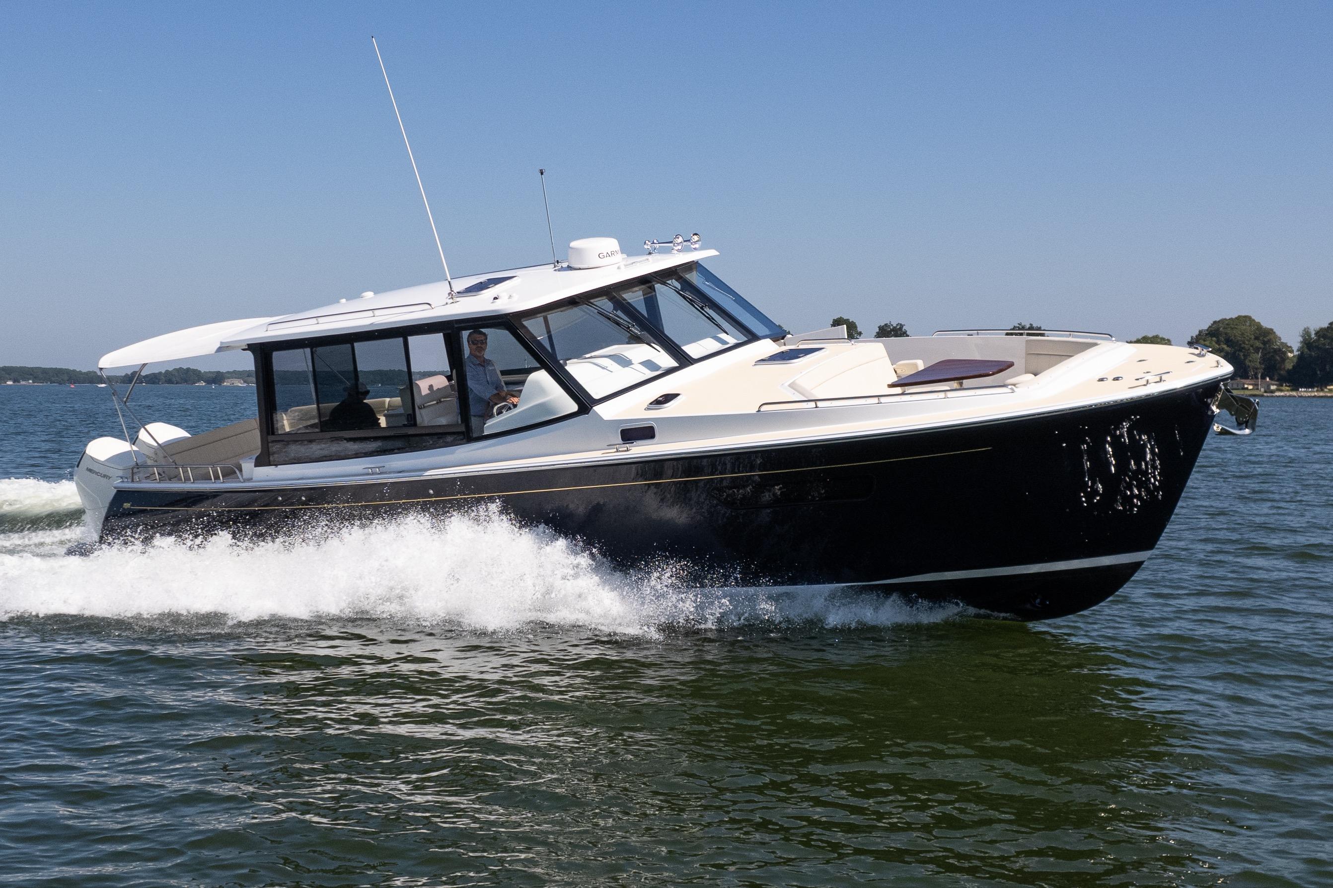 2023 MJM Yachts 4 cruising on open water, showcasing sleek design and performance.