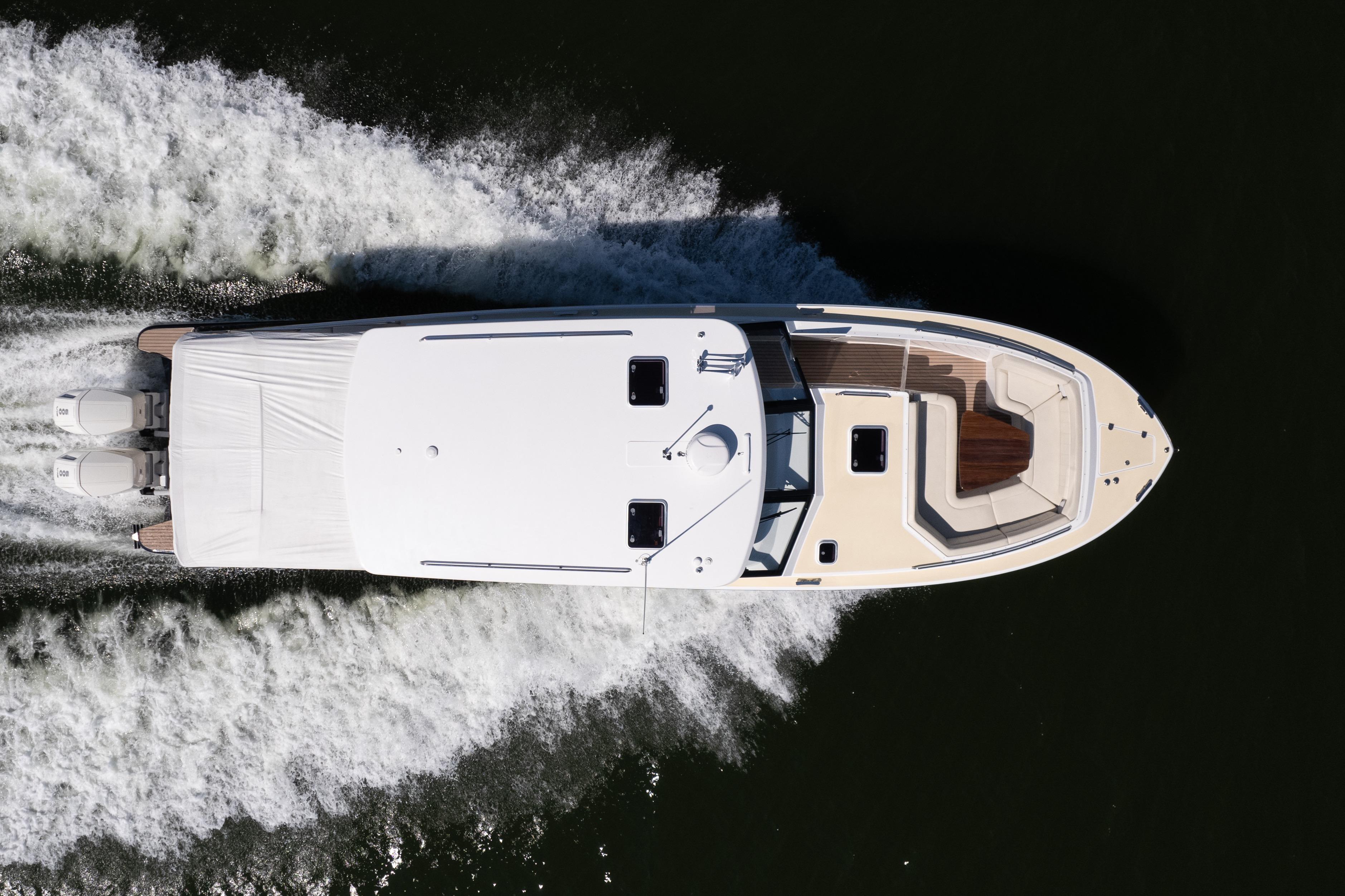 Aerial view of 2023 MJM Yachts 4 model cruising on water.