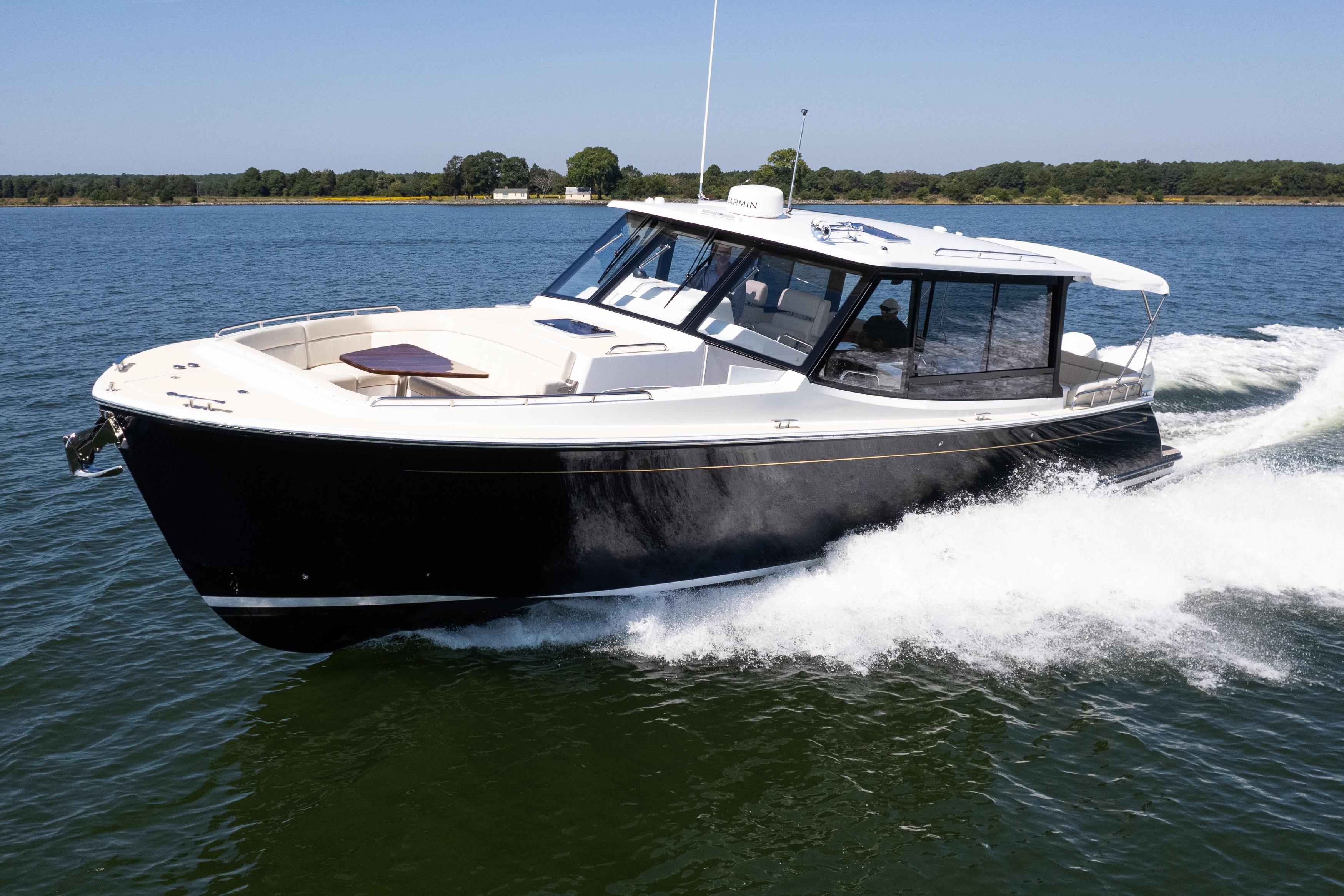 2023 MJM Yachts 4 cruising on open water, showcasing sleek design and performance.