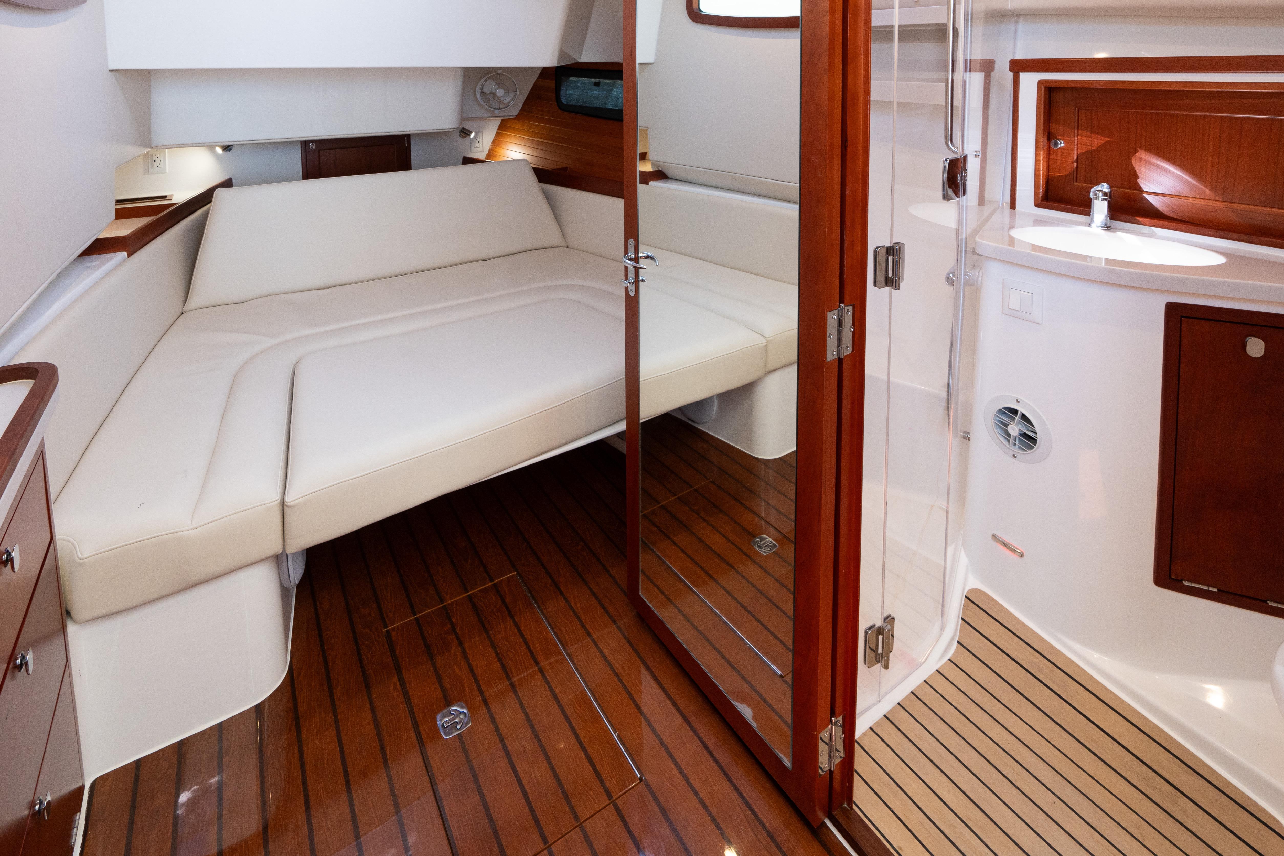 Luxurious interior of 2023 MJM Yachts 4, featuring elegant wood finishes and comfortable seating.