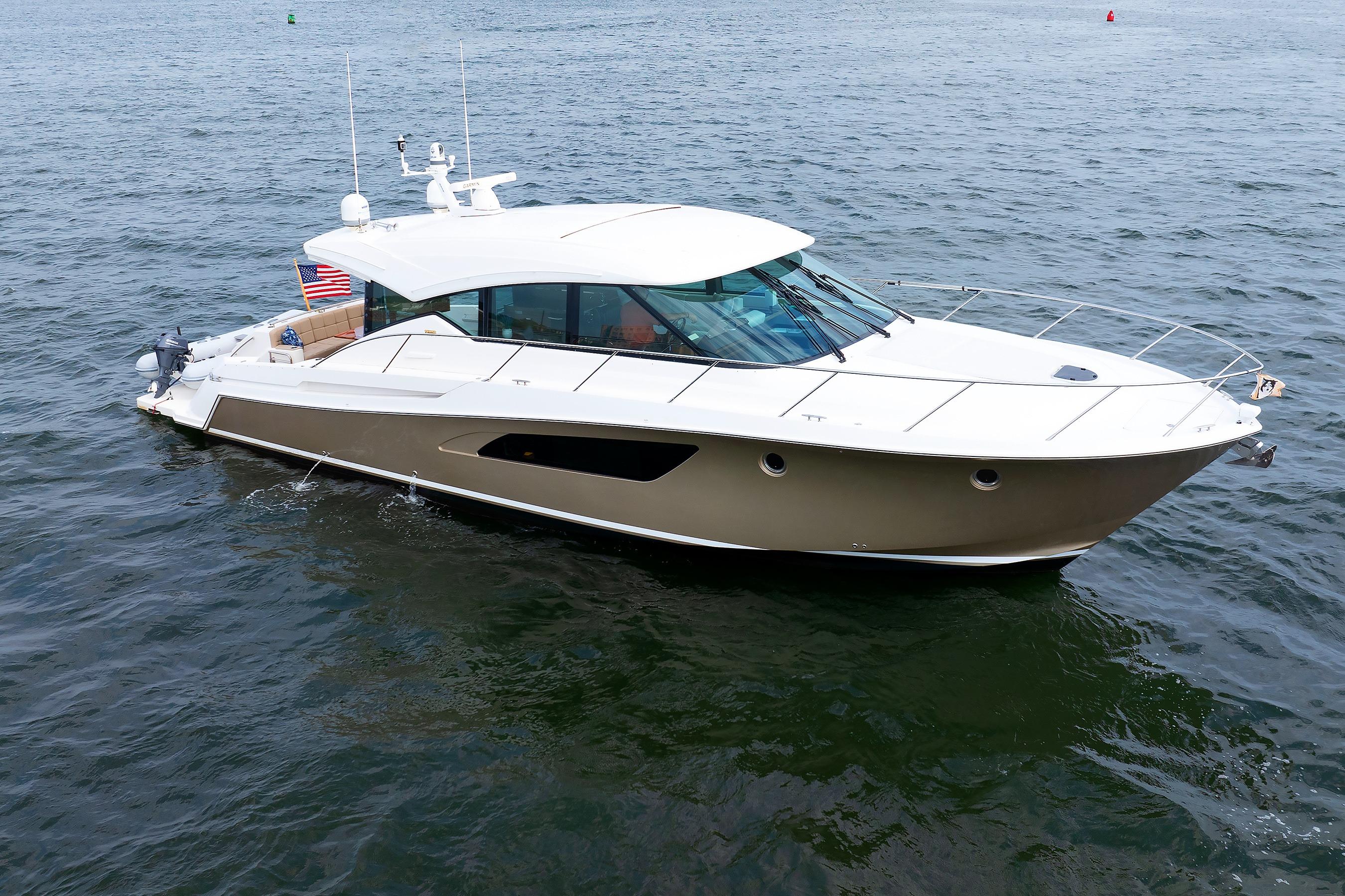 2014 Tiara 5000 Coupe yacht cruising on open water.