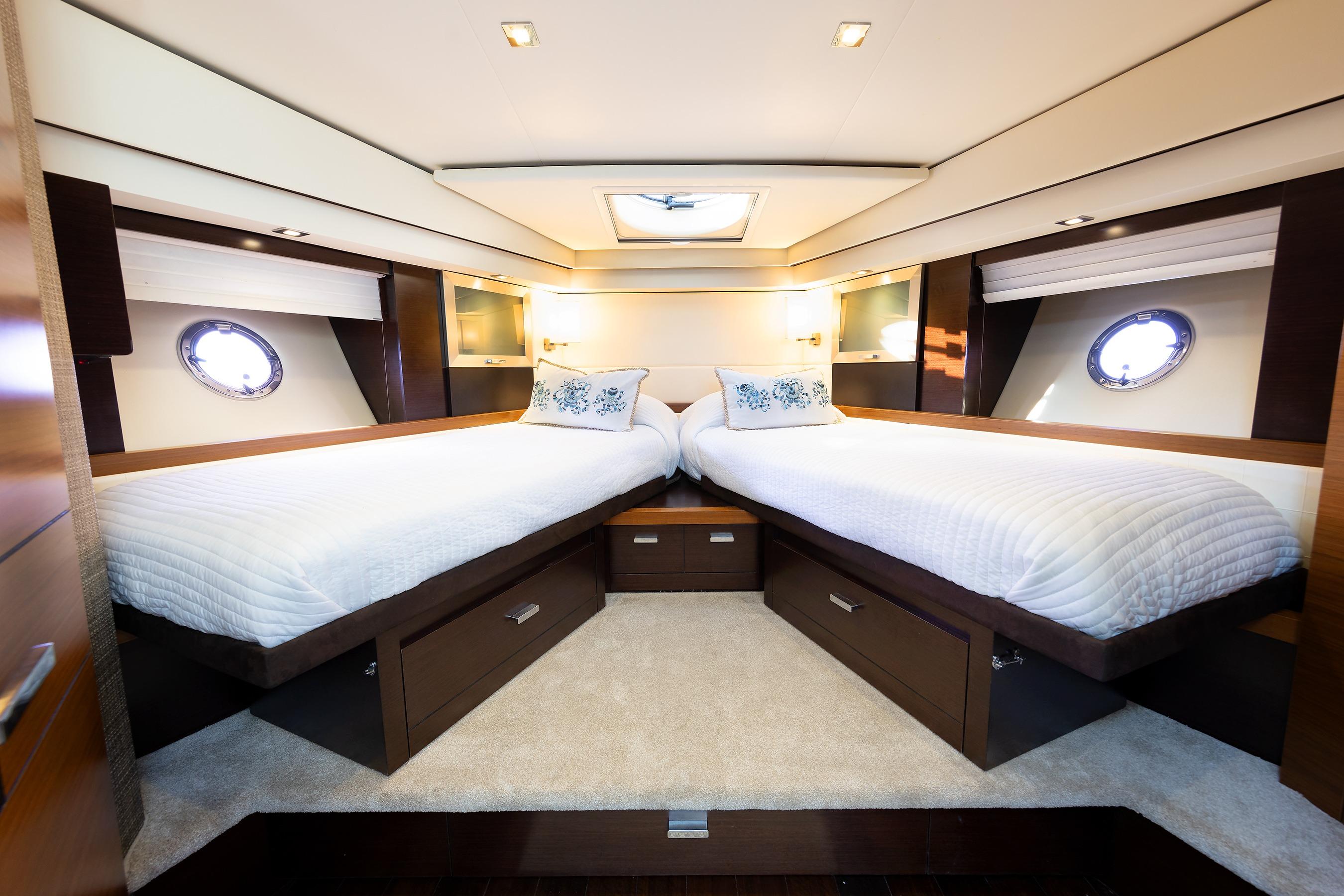 Luxurious 2014 Tiara 5000 Coupe yacht interior with twin beds and elegant design.