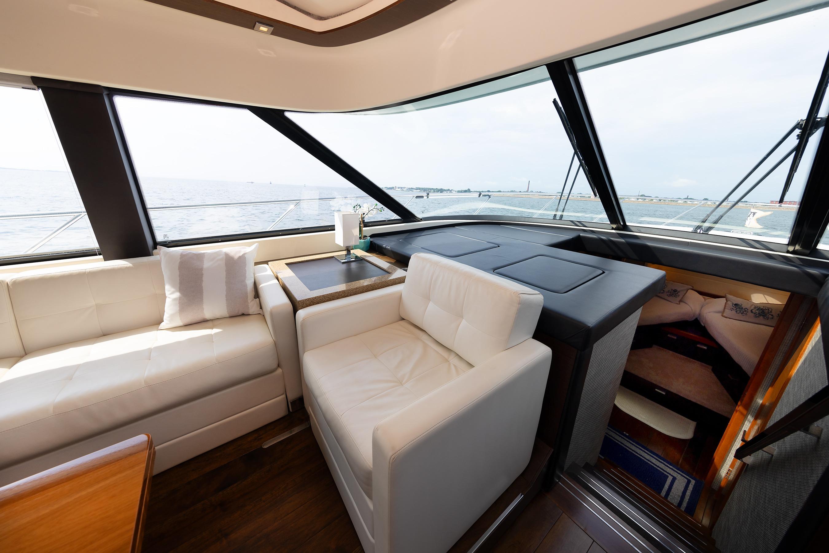 Luxurious interior of a 2014 Tiara 5000 Coupe yacht with ocean view.