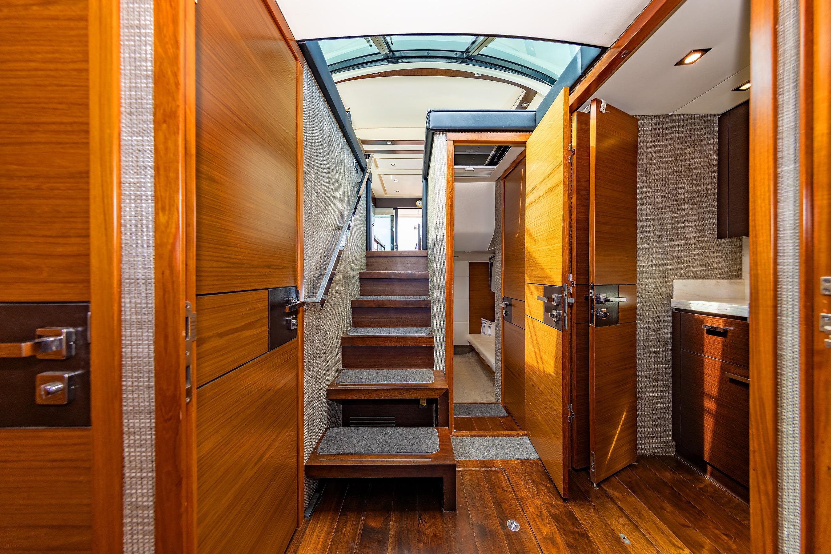 Luxurious interior of 2014 Tiara 5000 Coupe yacht with wooden finishes and modern design.