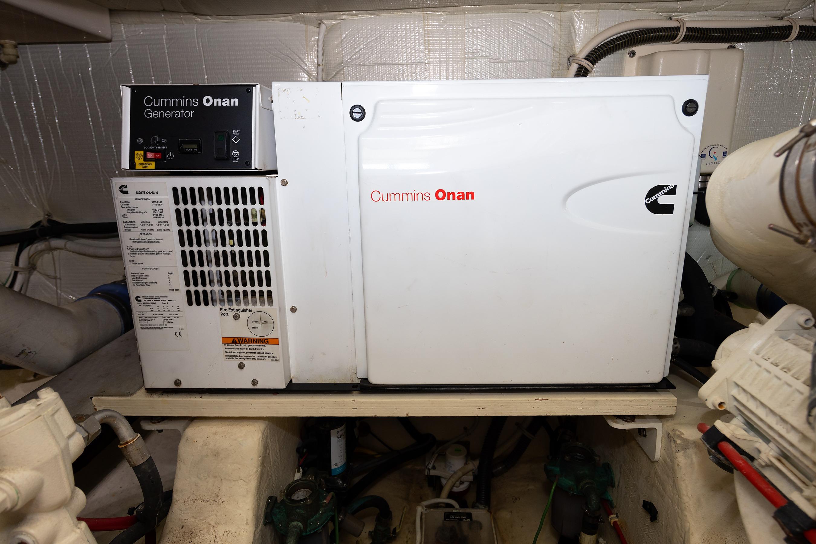 Cummins Onan generator in 2014 Tiara 5000 Coupe engine room.