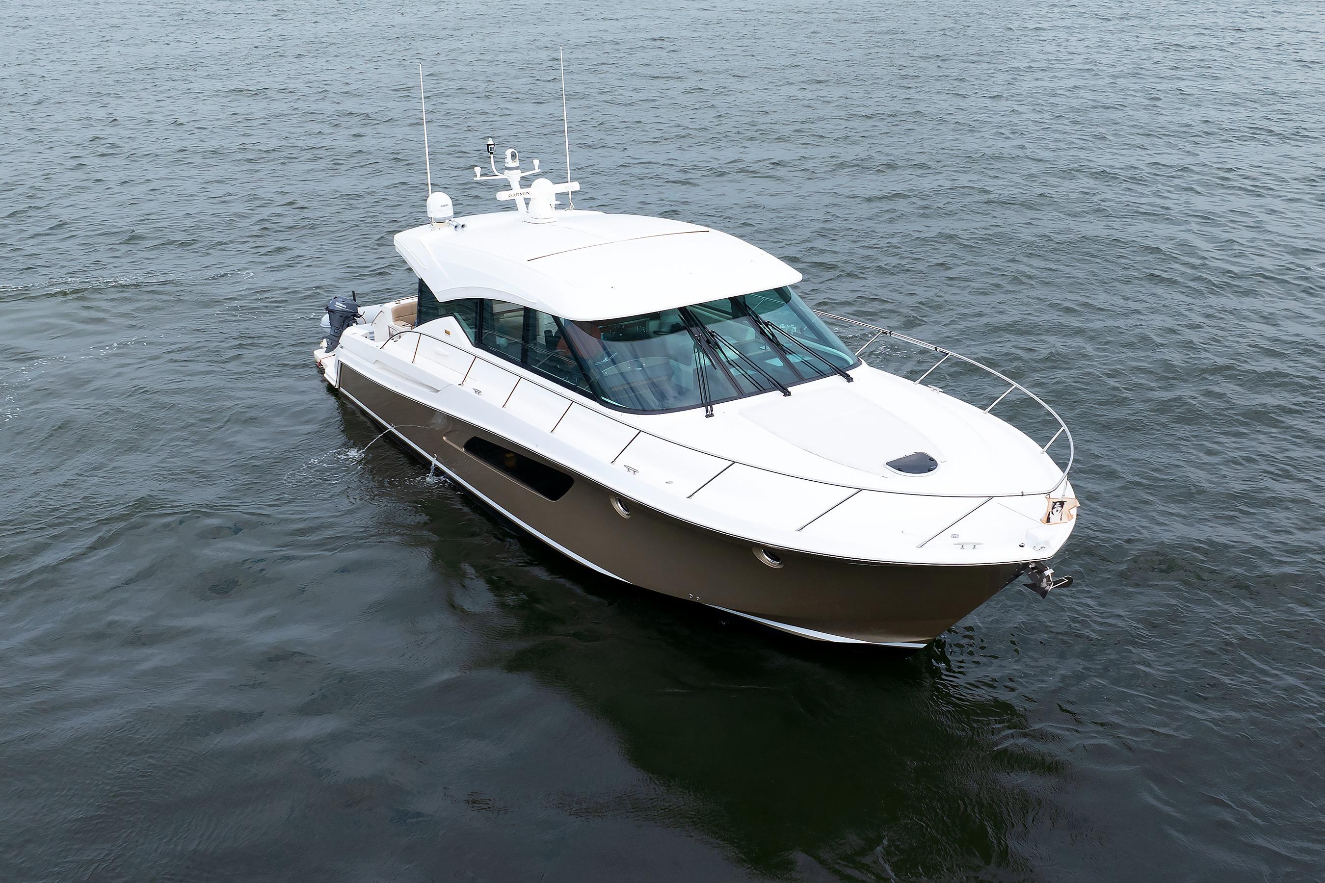 2014 Tiara 5000 Coupe yacht cruising on open water.