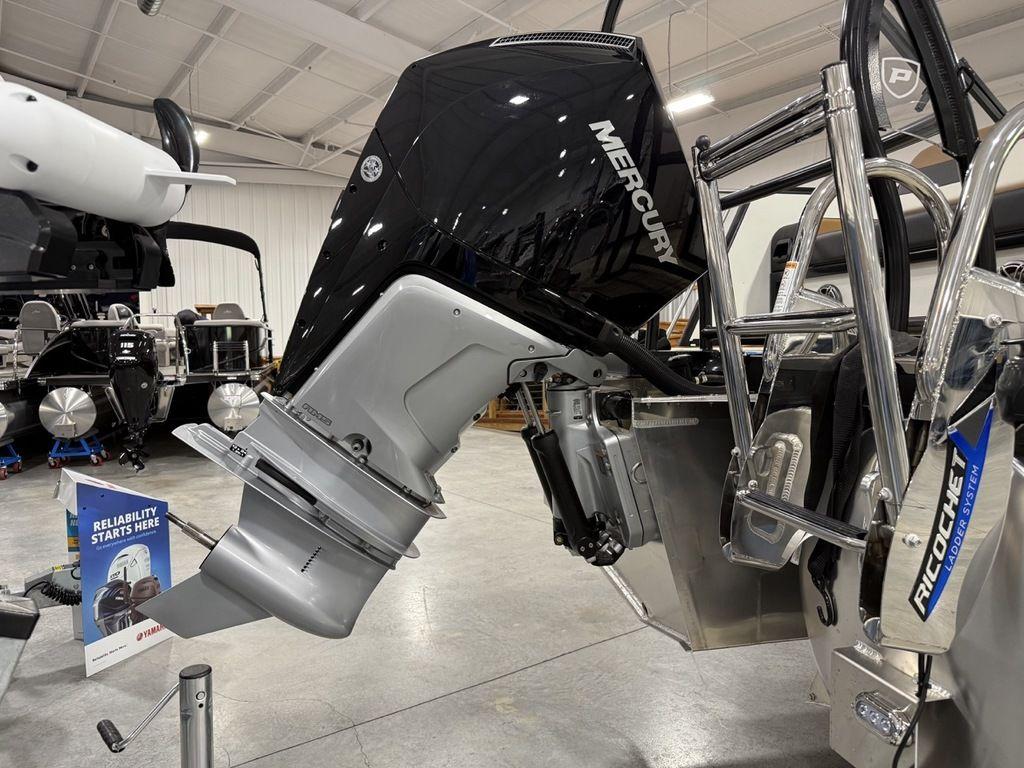 Outboard motor on a 2025 Premier 230 Solaris RL boat in a showroom.