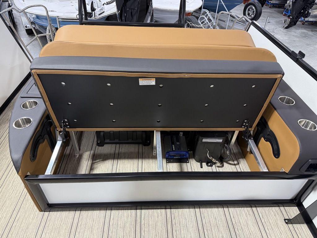 2025 Premier 230 Solaris RL boat interior with storage compartment and cup holders.