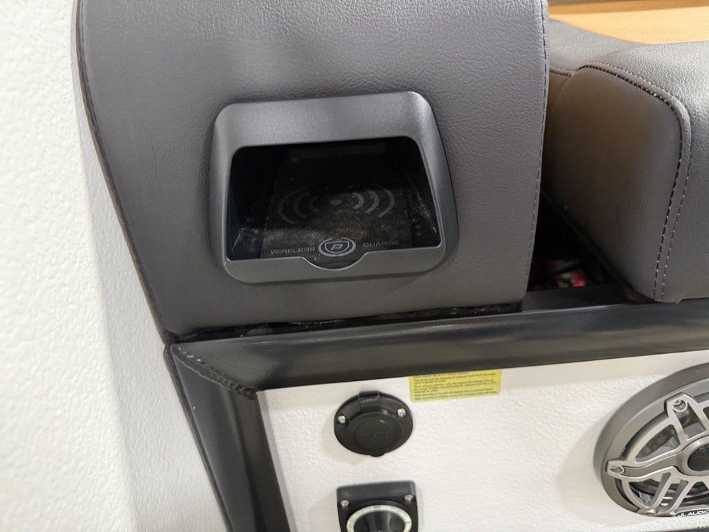 2025 Premier 230 Solaris RL interior with wireless charging pad and speaker system.