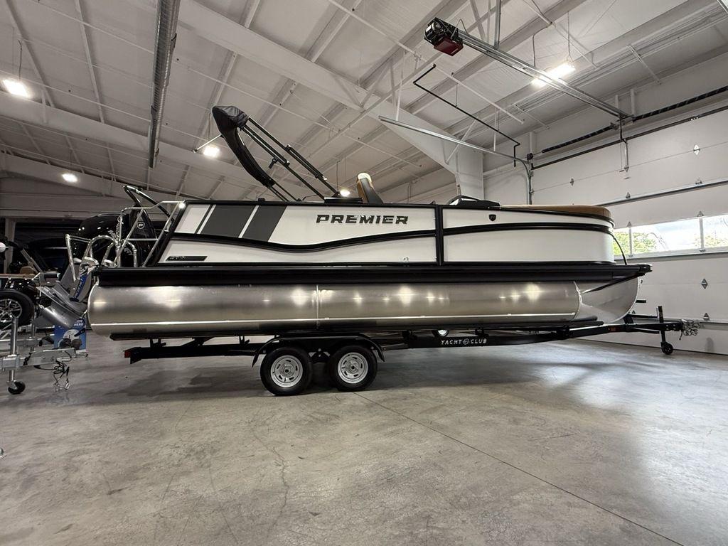 2025 Premier 230 Solaris RL pontoon boat in a spacious indoor showroom.