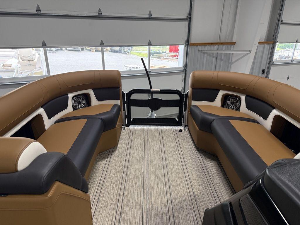 2025 Premier 230 Solaris RL interior with luxurious seating and modern design in a showroom.