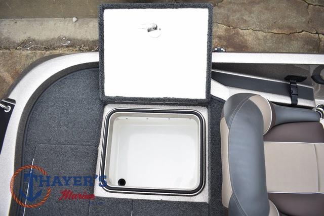 2025 Ranger Z185 boat storage compartment with open lid, gray interior, and adjacent seating.