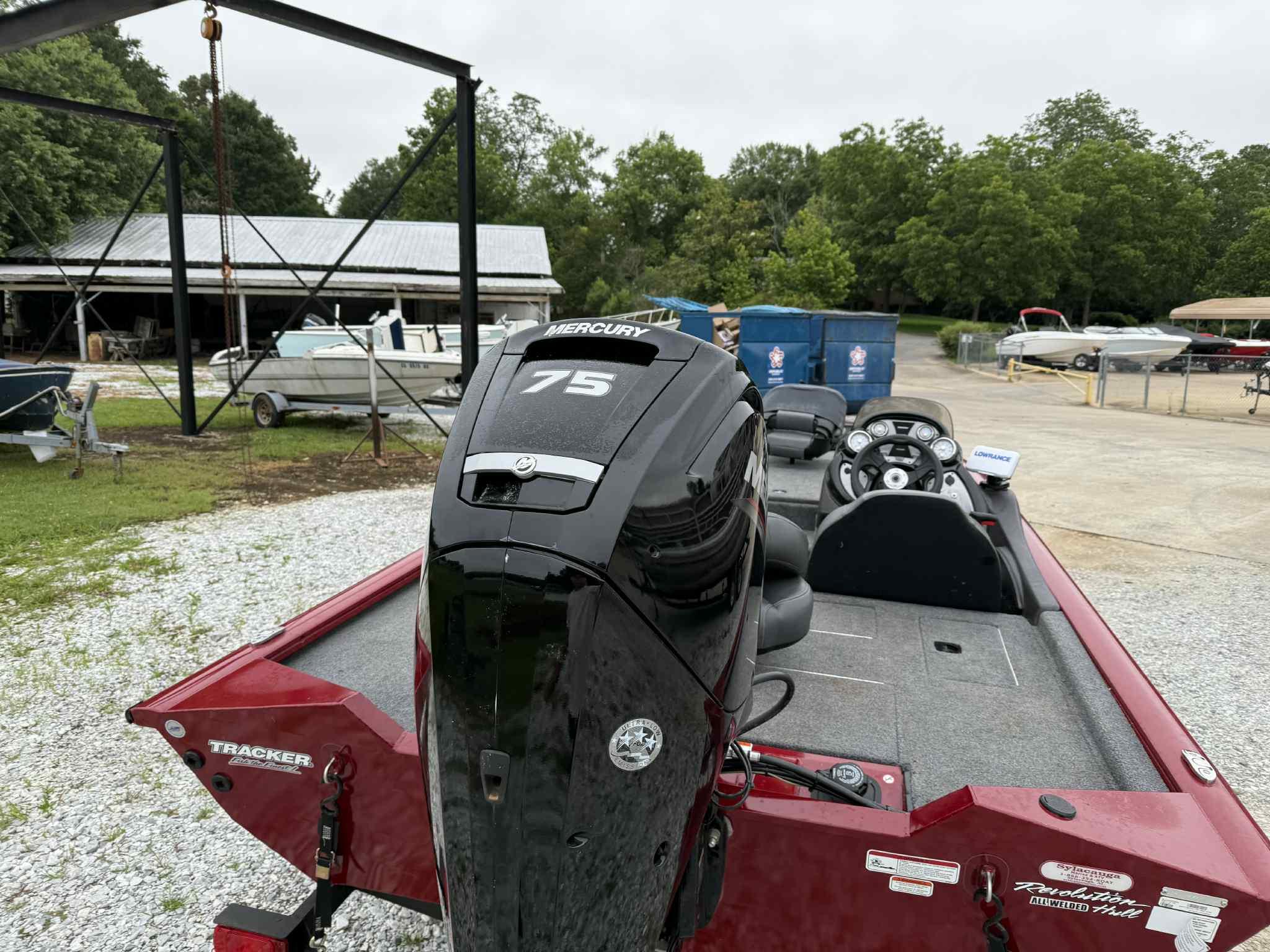 2022 Tracker Pro Team 175 TXW boat with Mercury 75 engine, parked outdoors.