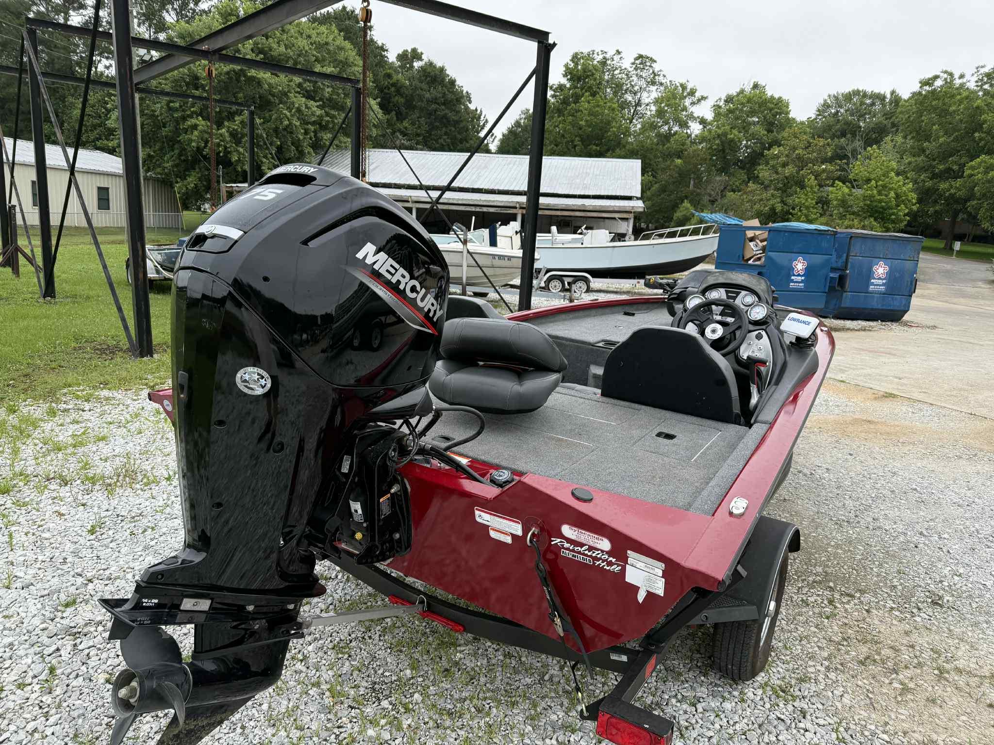 2022 Tracker Pro Team 175 TXW boat with Mercury engine, parked outdoors.