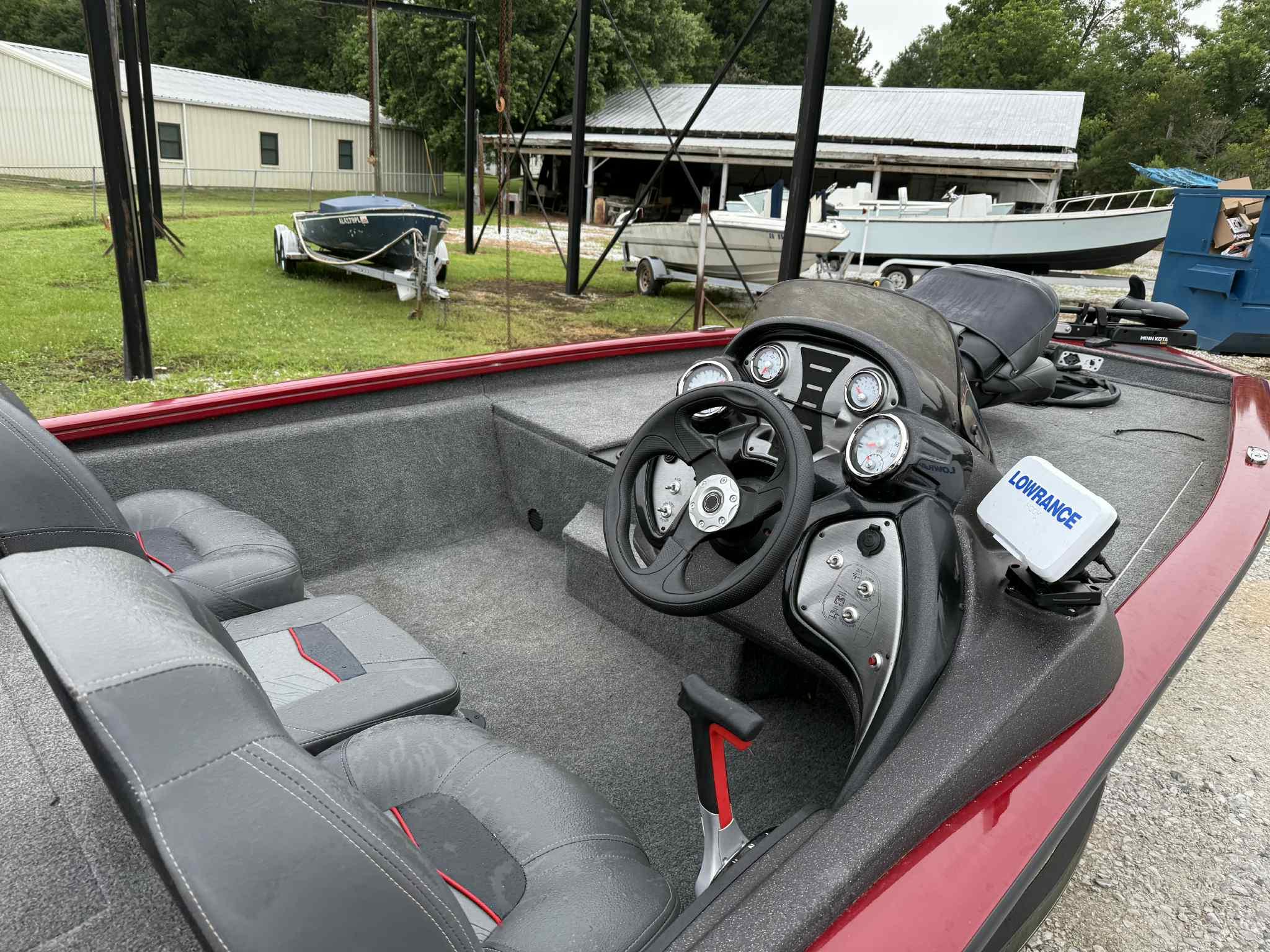 2022 Tracker Pro Team 175 TXW boat interior with steering console and Lowrance device.