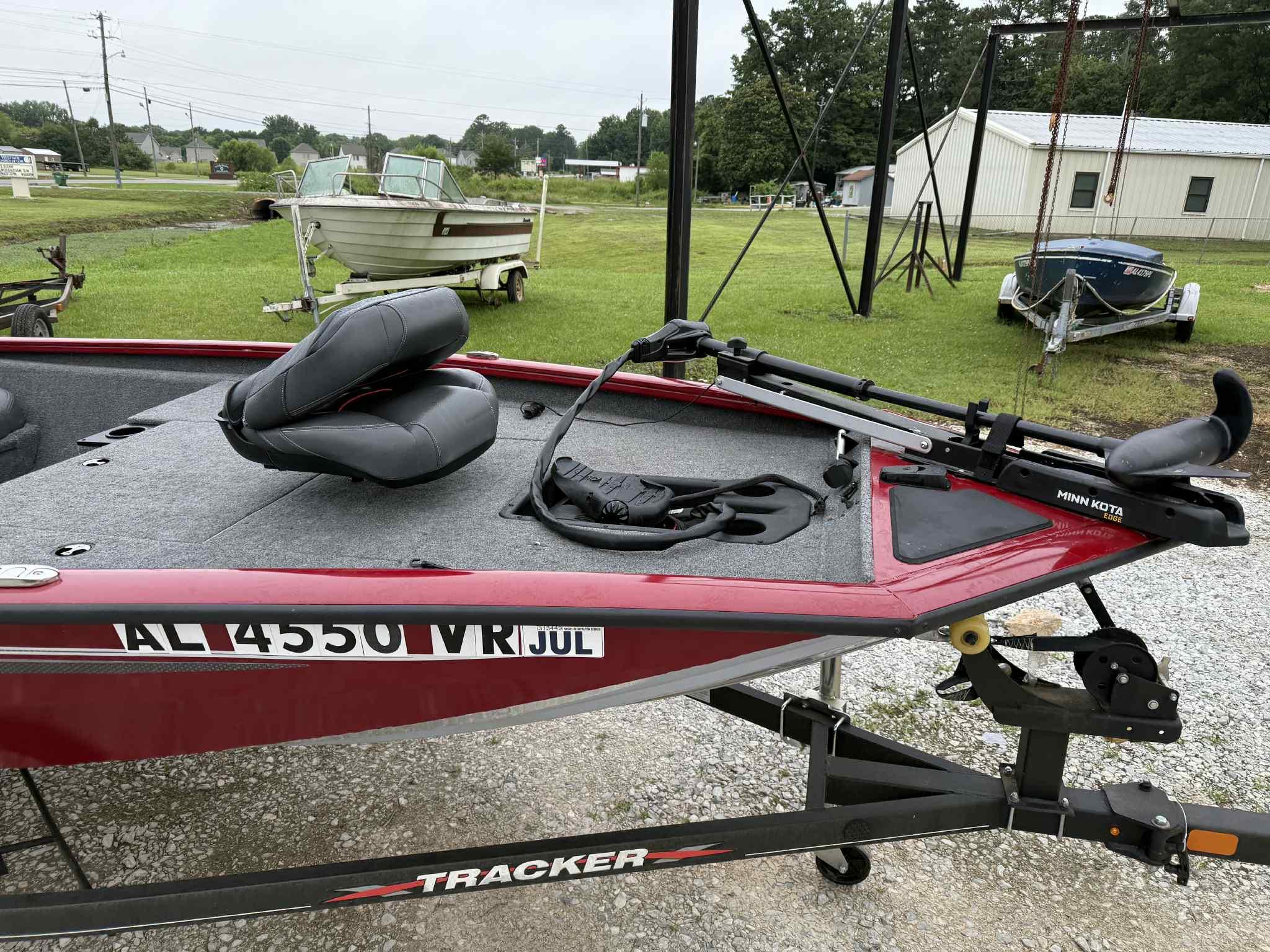 2022 Tracker Pro Team 175 TXW boat on trailer, red exterior, Minn Kota trolling motor.