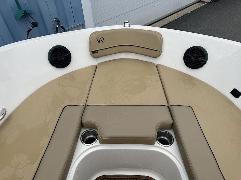 2023 Bayliner VR6 boat interior with beige seating and cup holders.