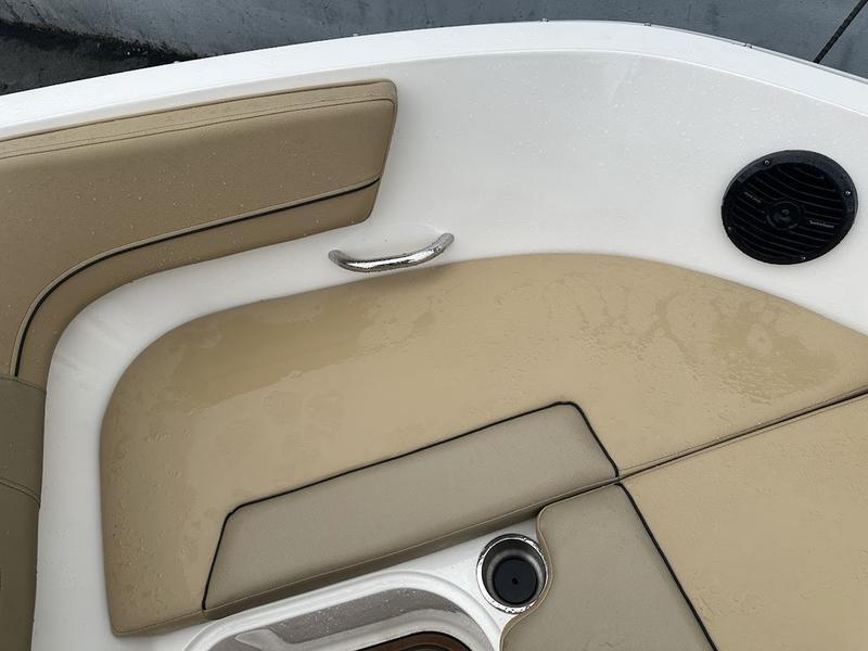 2023 Bayliner VR6 boat interior with beige seating and speaker.