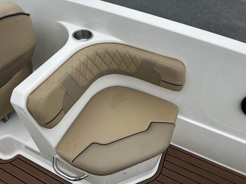 2023 Bayliner VR6 boat seat with beige upholstery and cup holder.