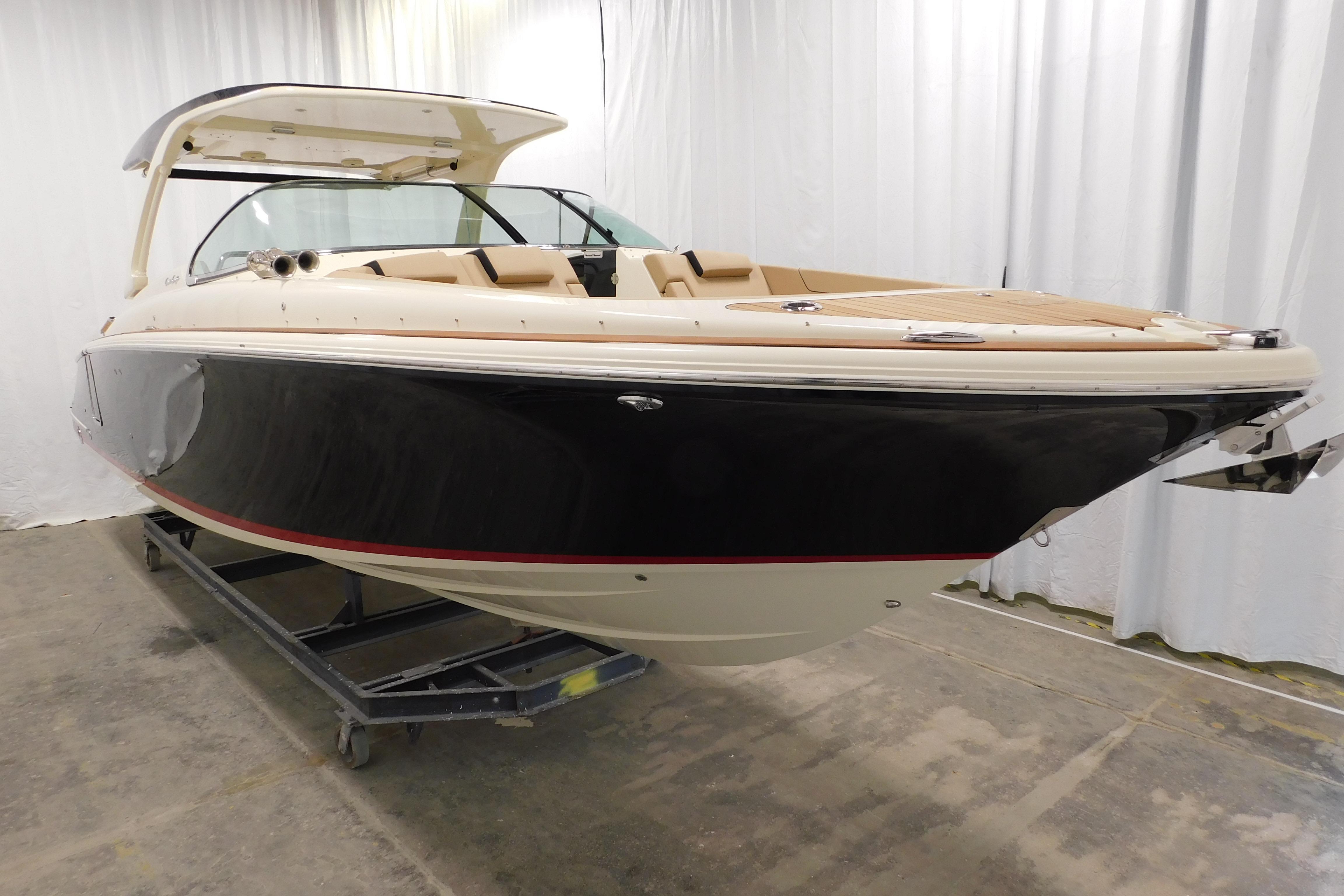 2021 Chris-Craft Launch 35 GT boat in showroom, featuring sleek design and luxury finishes.