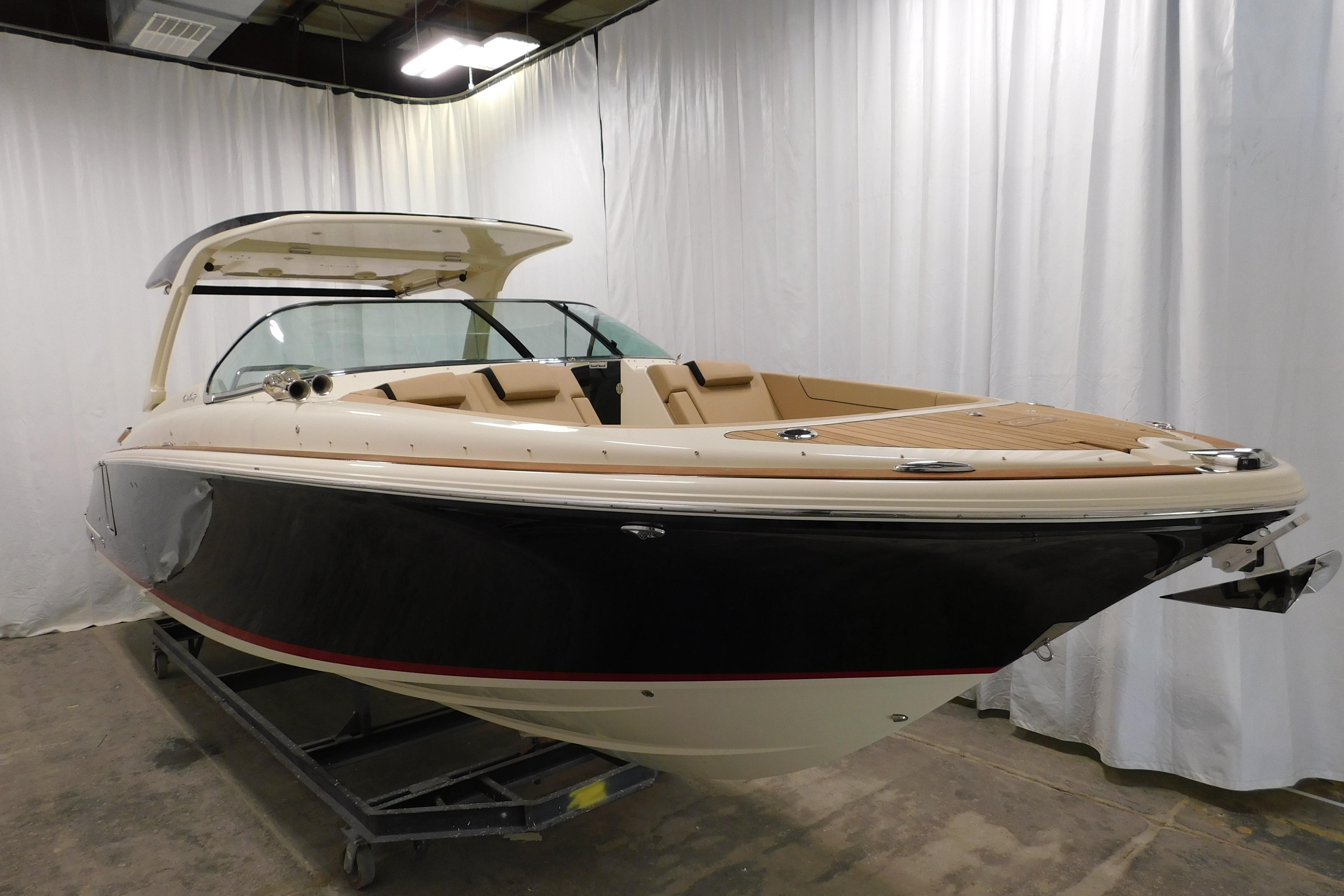2021 Chris-Craft Launch 35 GT boat in showroom, showcasing sleek design and luxury features.