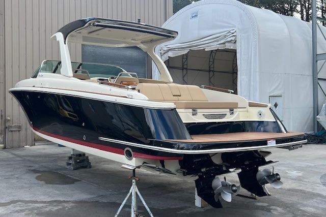 2021 Chris-Craft Launch 35 GT boat with dual engines, docked outdoors.