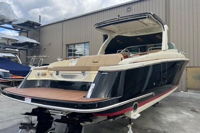 2021 Chris-Craft Launch 35 GT boat with sleek design, docked outdoors.