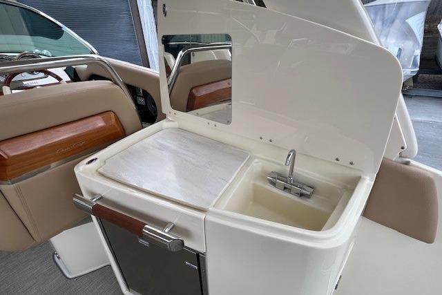 2021 Chris-Craft Launch 35 GT boat interior with sink and storage area.