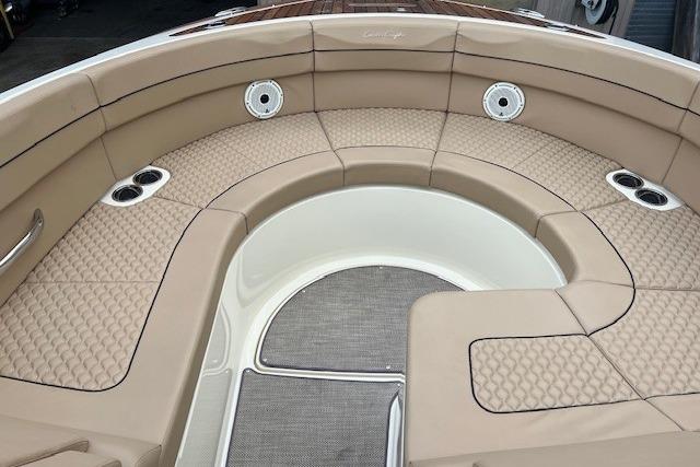 Luxurious seating area on 2021 Chris-Craft Launch 35 GT boat, featuring tan upholstery.