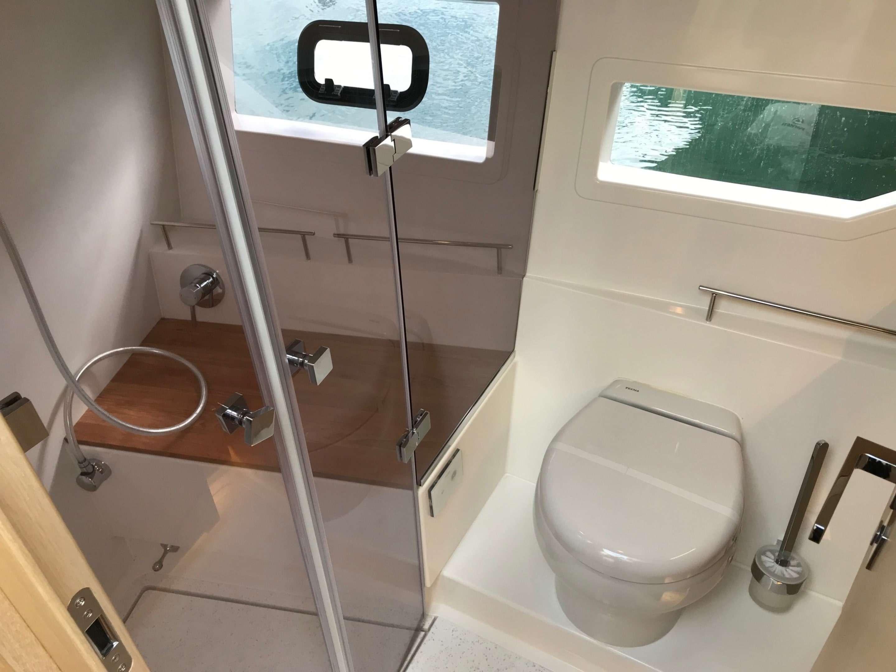 Skamander-Monaco Coupe 2025 -FL-US-2025 Skamander Monaco Coupe bathroom with shower, toilet, and window view.-9544362 | Thumbnail