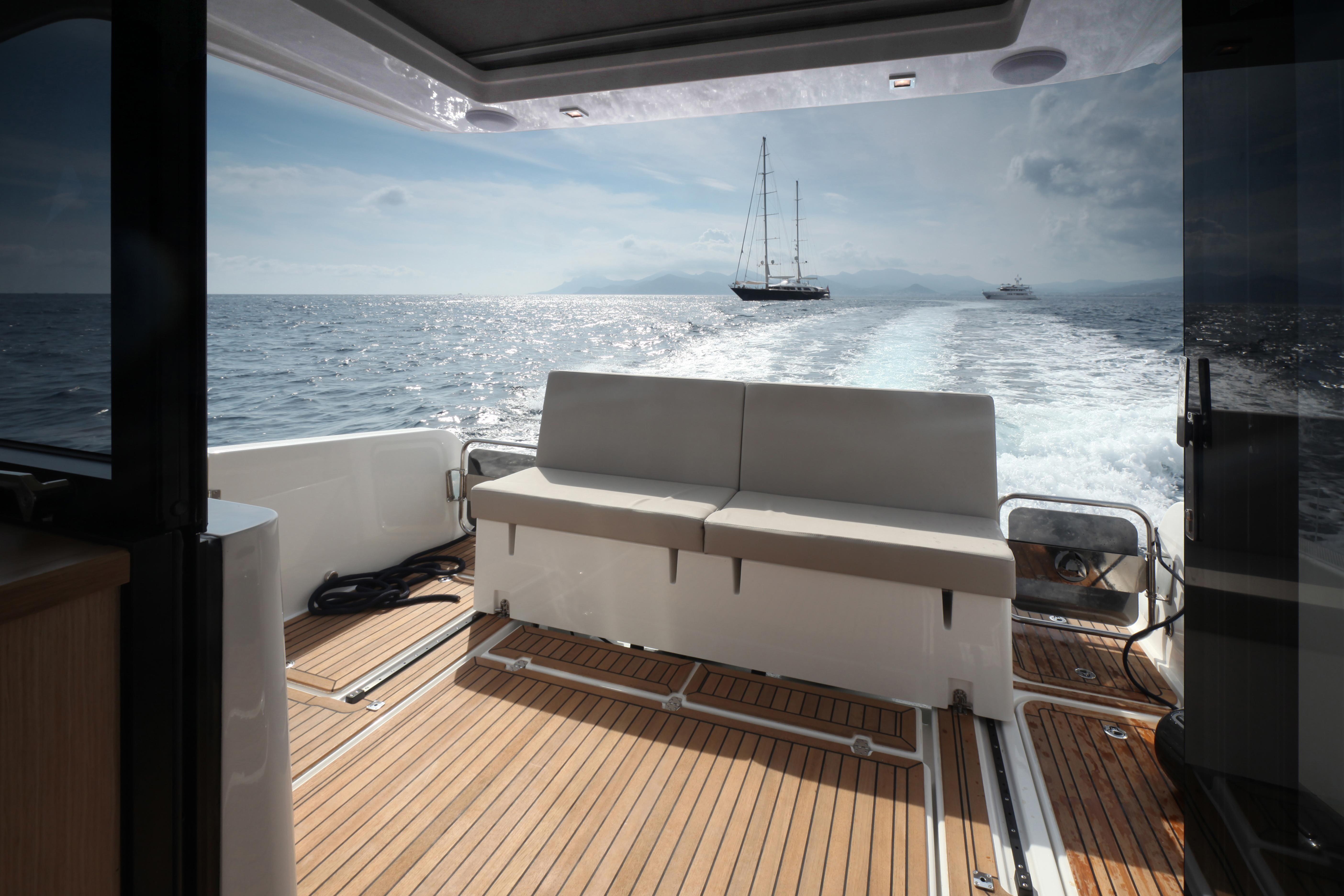 Skamander-Monaco Coupe 2025 -FL-US-2025 Skamander Monaco Coupe boat interior with ocean view and distant sailboat.-9544362 | Thumbnail