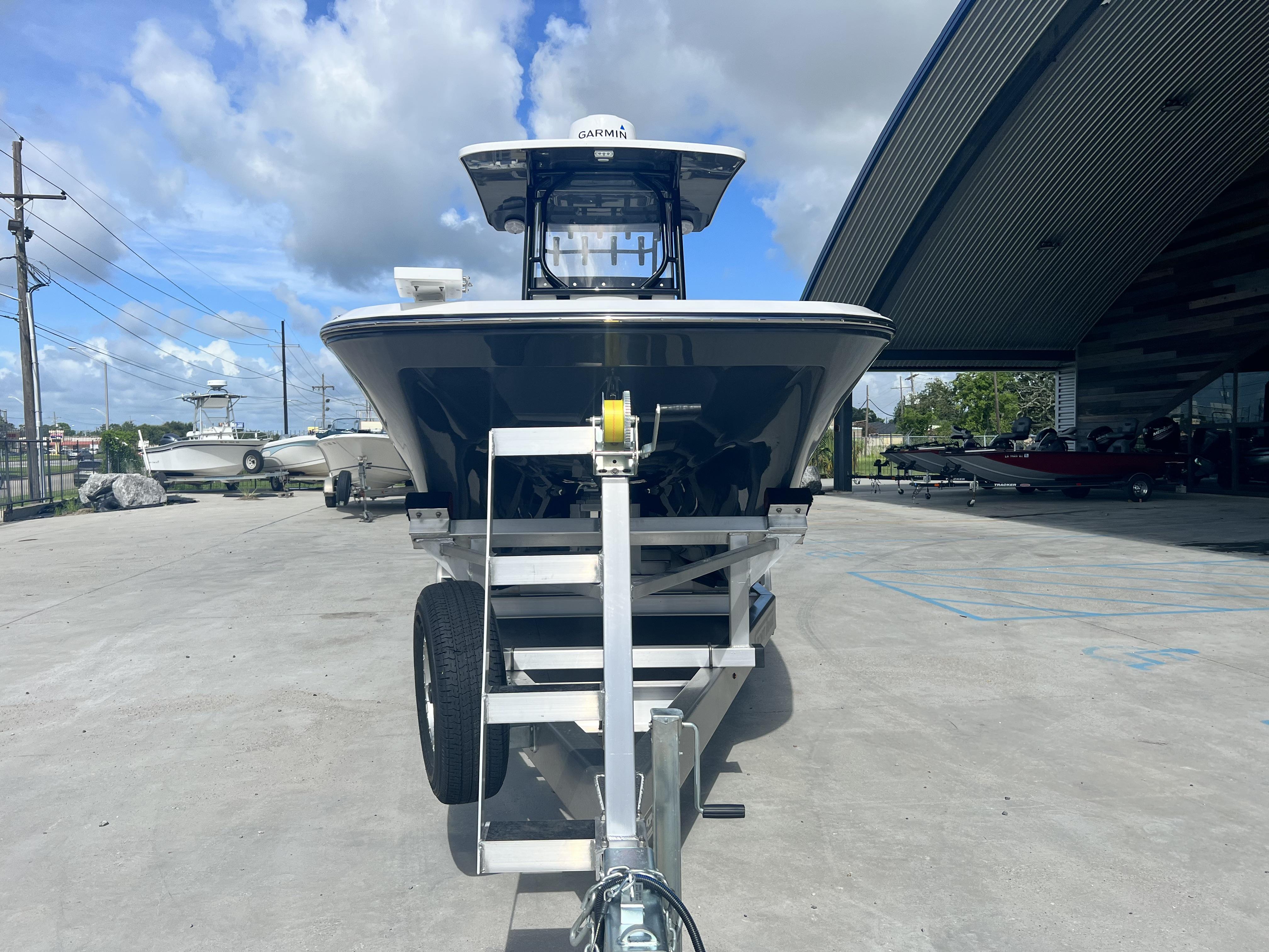 2023 Sea Cat 260 HC boat on trailer, parked outdoors under a cloudy sky.