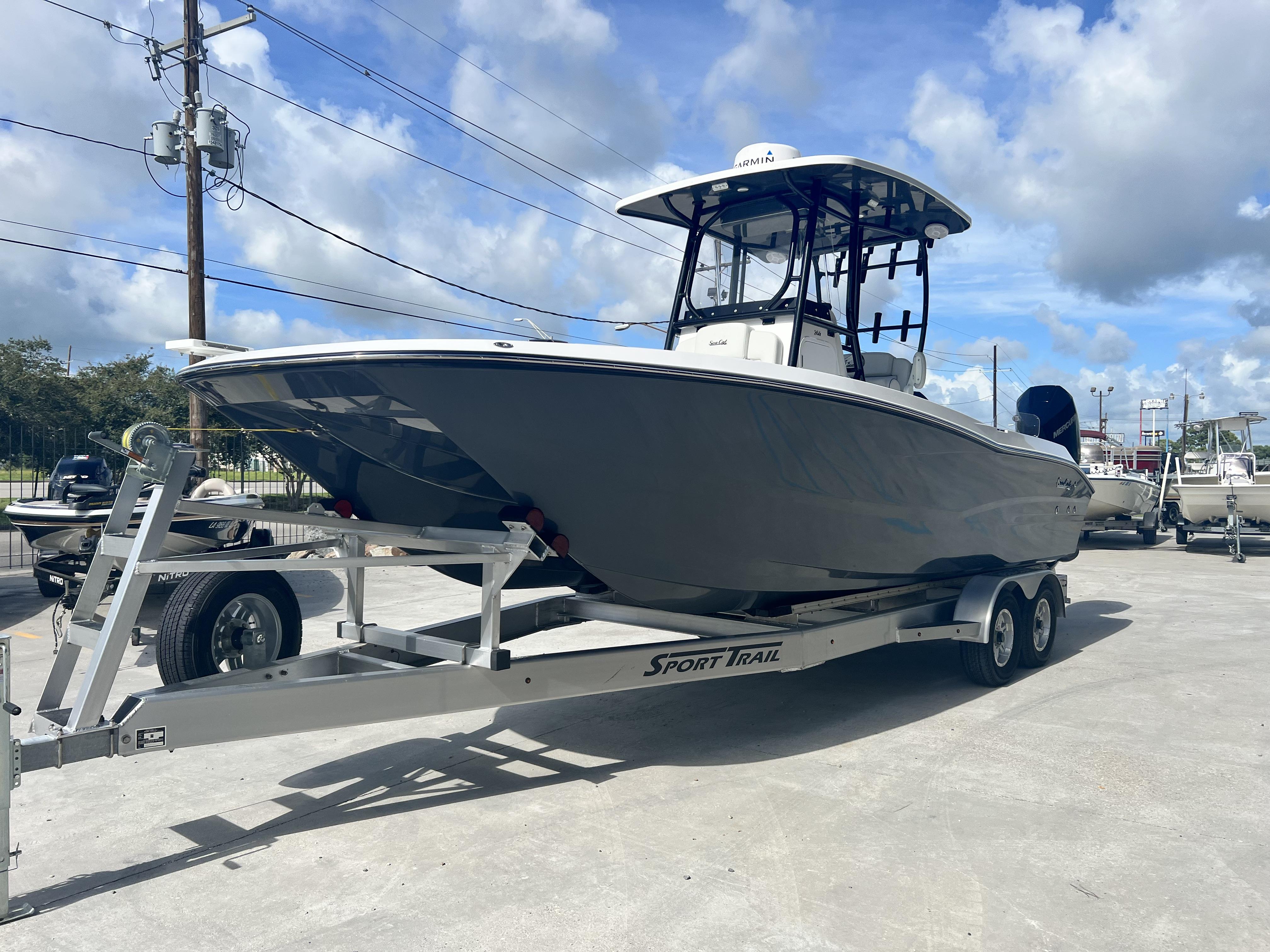 2023 Sea Cat 260 HC boat on trailer under blue sky.