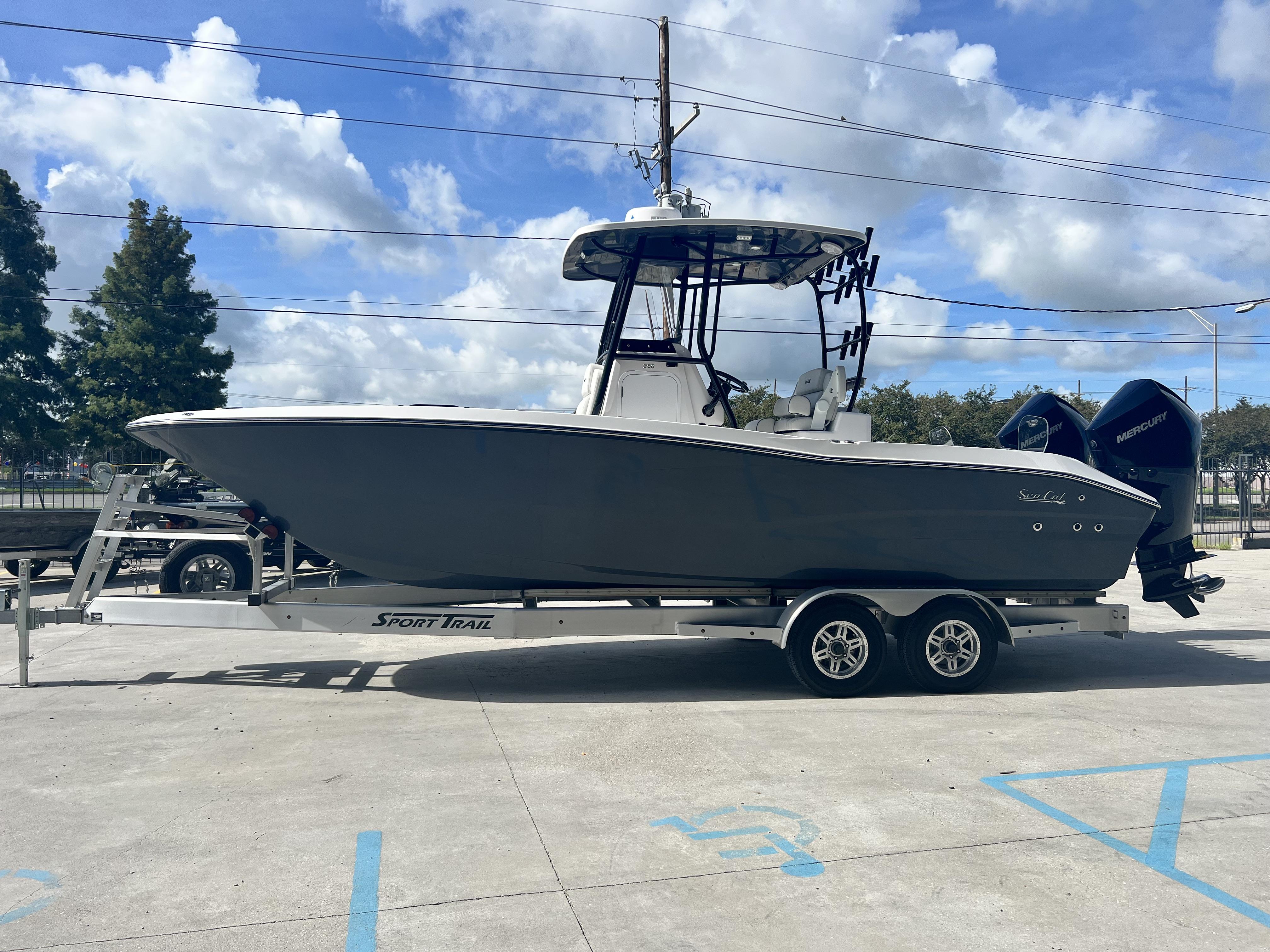 2023 Sea Cat 260 HC boat on trailer under blue sky.