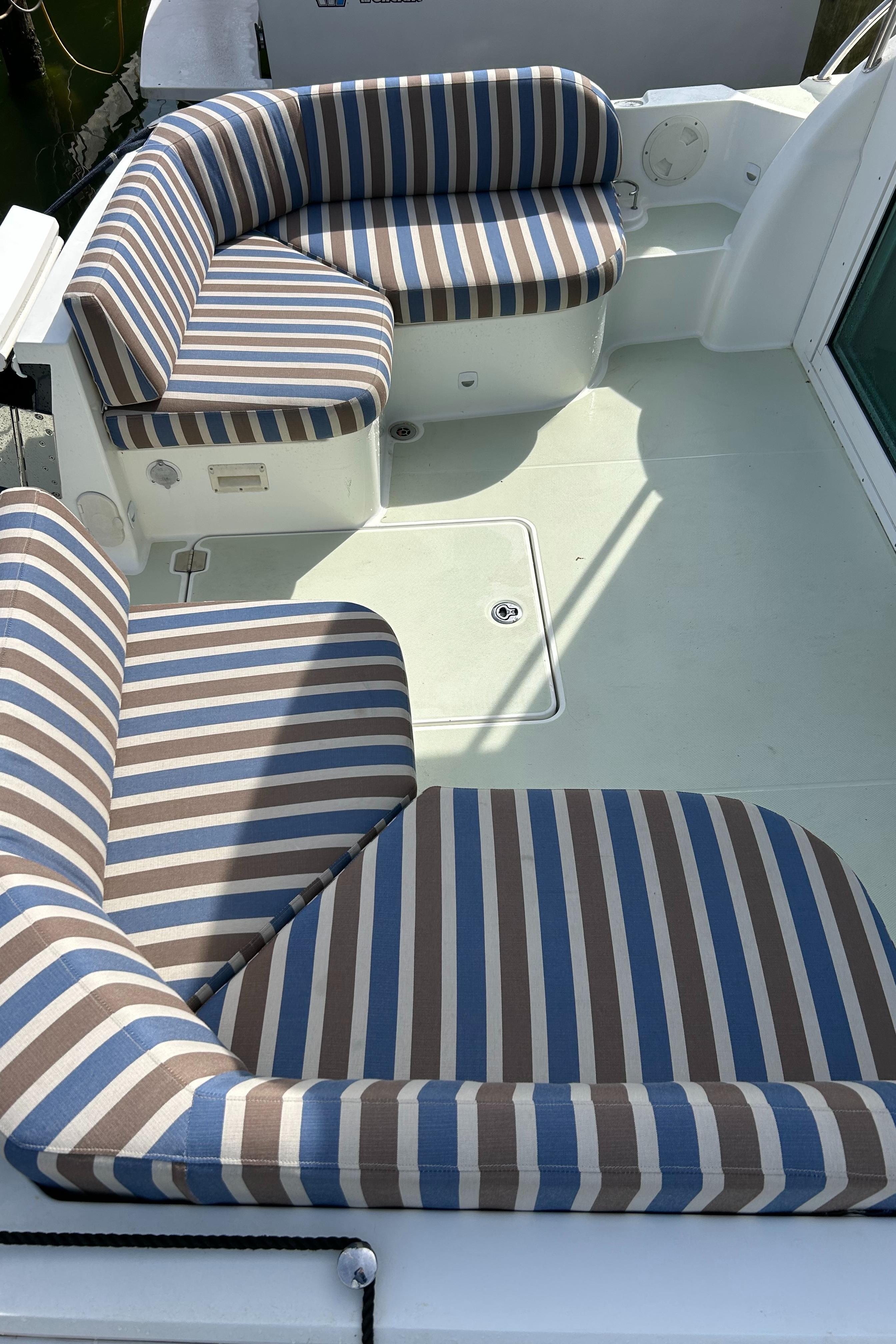2018 Back Cove 32 boat with striped seating on deck.