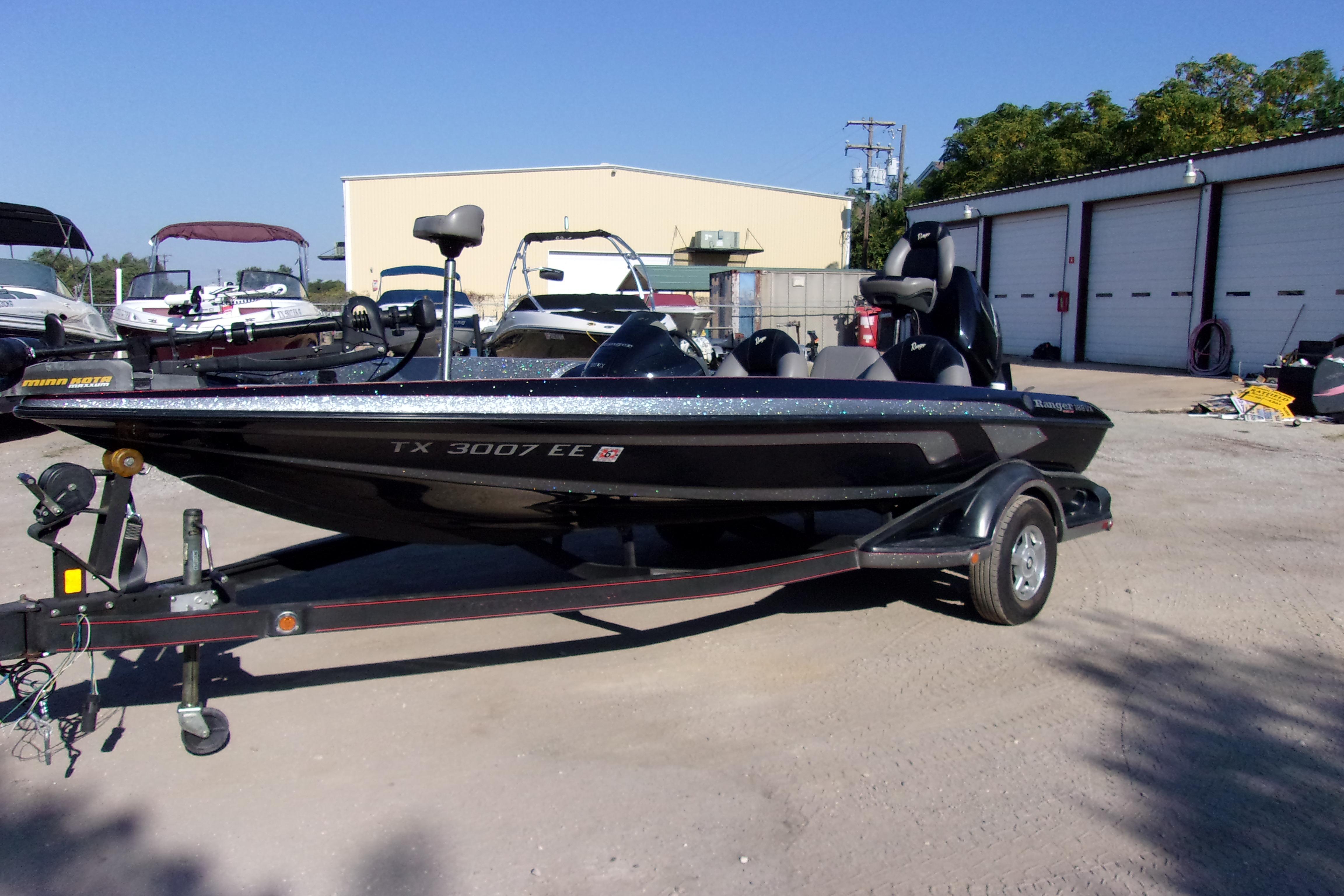 2009 Ranger 188 VX boat on trailer in outdoor storage area.
