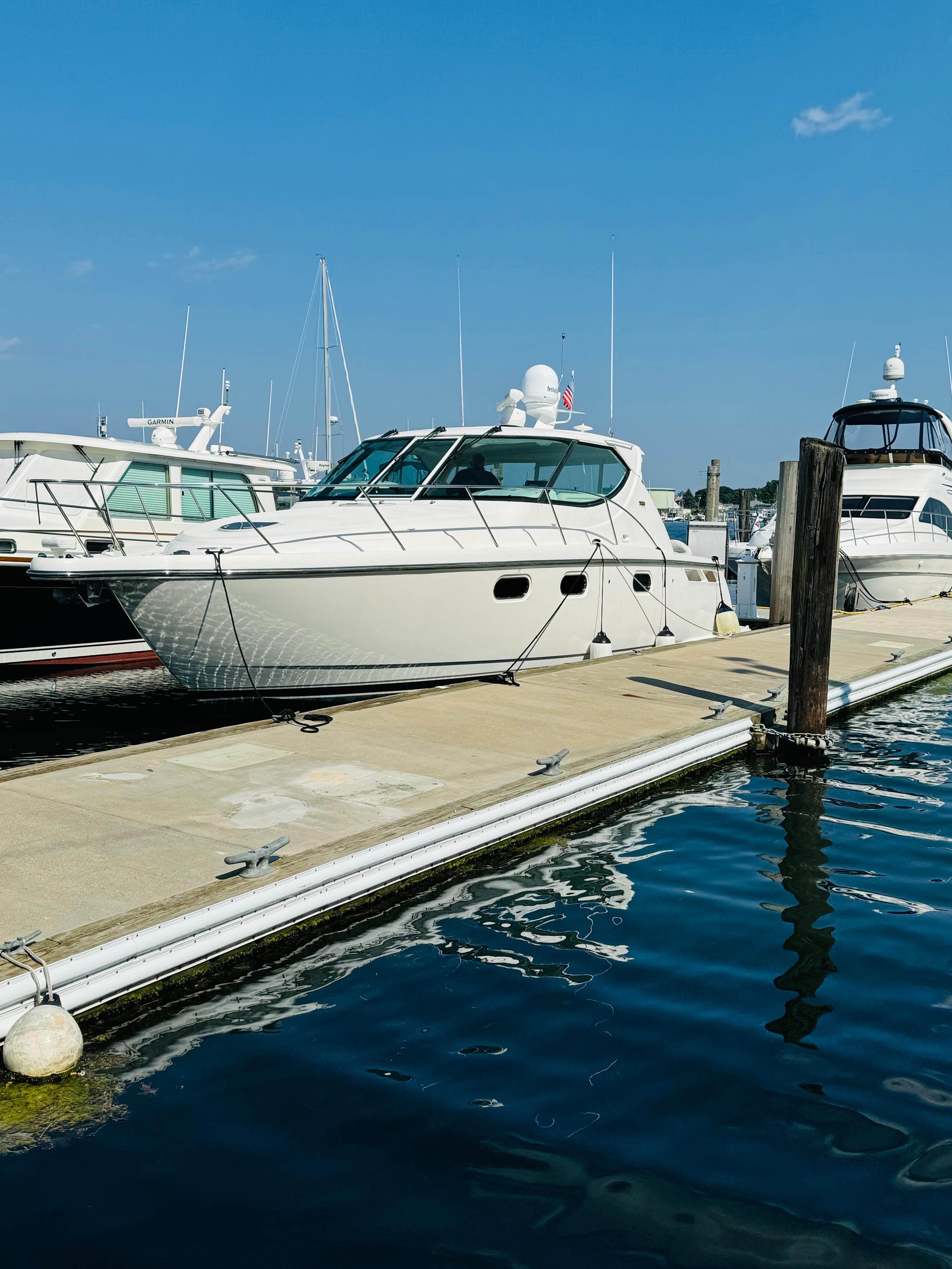 2007 Tiara Yachts 3900 Sovran docked at a marina on a sunny day.