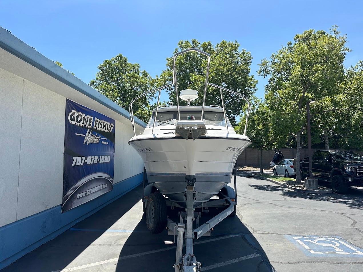 1992 Bayliner 2359 Trophy boat on trailer at Gone Fishin' Marine dealership.