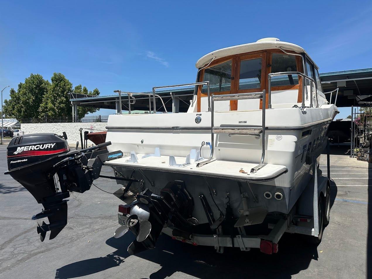 1992 Bayliner 2359 Trophy boat with Mercury outboard motor on trailer.