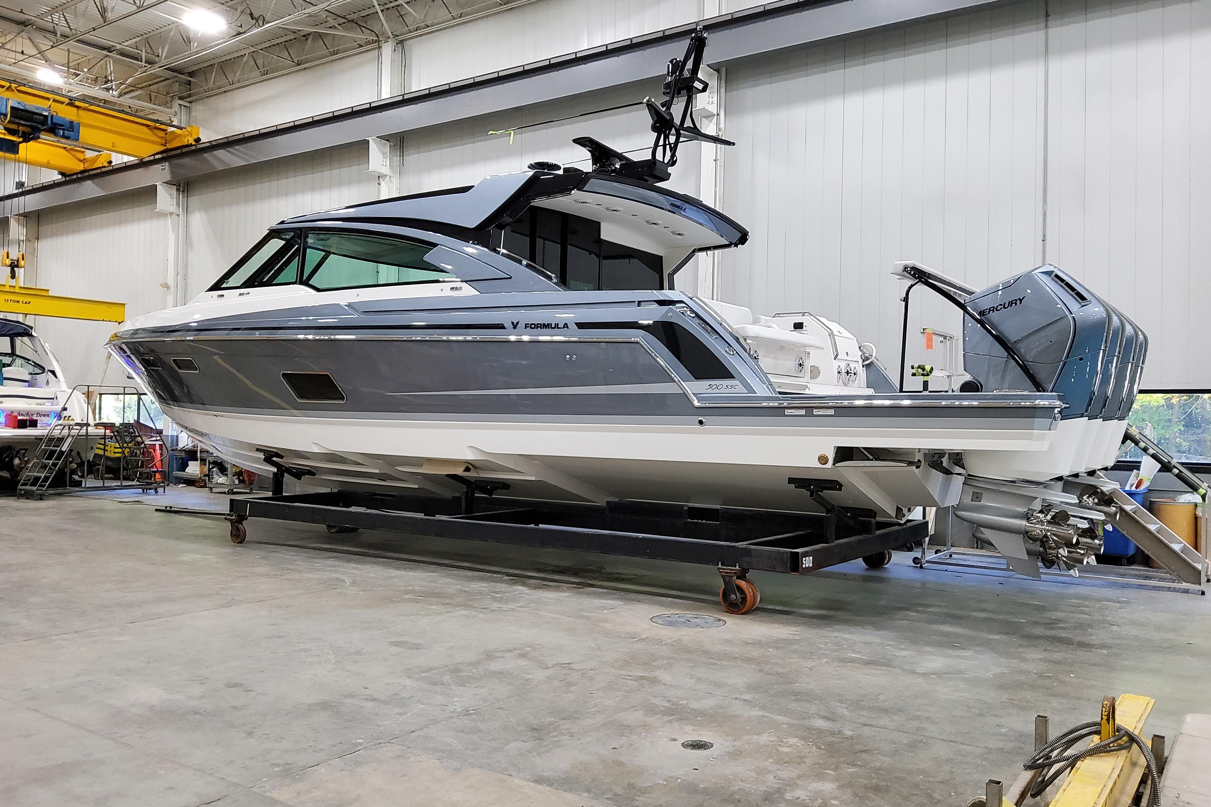 2026 Formula 500 Super Sport Crossover boat in a warehouse setting.