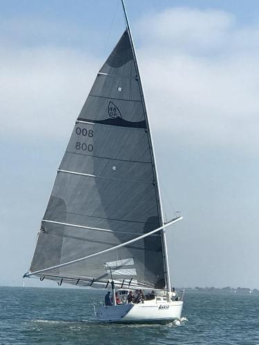 Sailing yacht Wyliecat 48, 2000 model, gliding on open water.