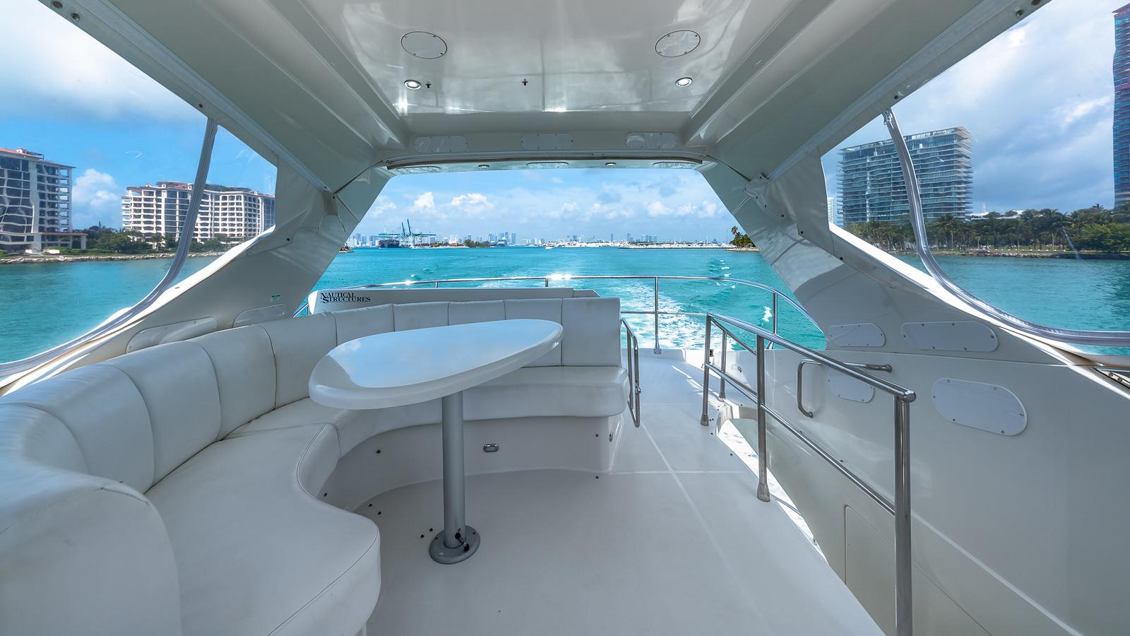Marquis-59 2005-Next to Sell FL-US-Luxurious 2005 Marquis 59 yacht interior with ocean view and modern seating.-9654462 | Thumbnail