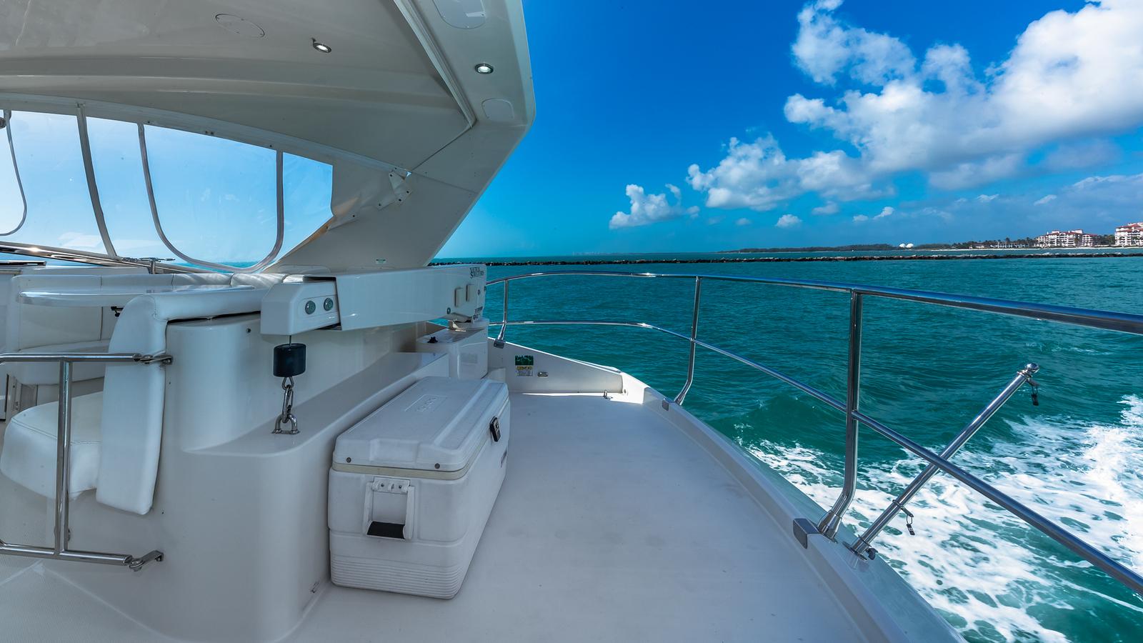Marquis-59 2005-Next to Sell FL-US-Luxurious 2005 Marquis 59 yacht cruising on clear blue waters under a sunny sky.-9654462 | Thumbnail