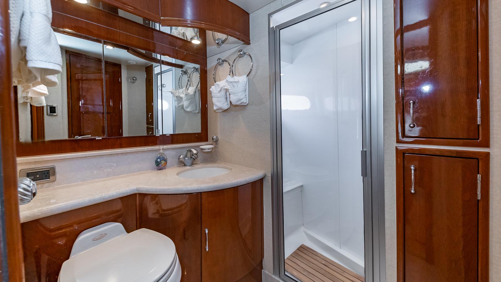Marquis-59 2005-Next to Sell FL-US-Luxurious bathroom in 2005 Marquis 59 yacht with wood cabinetry and modern shower.-9654462 | Thumbnail