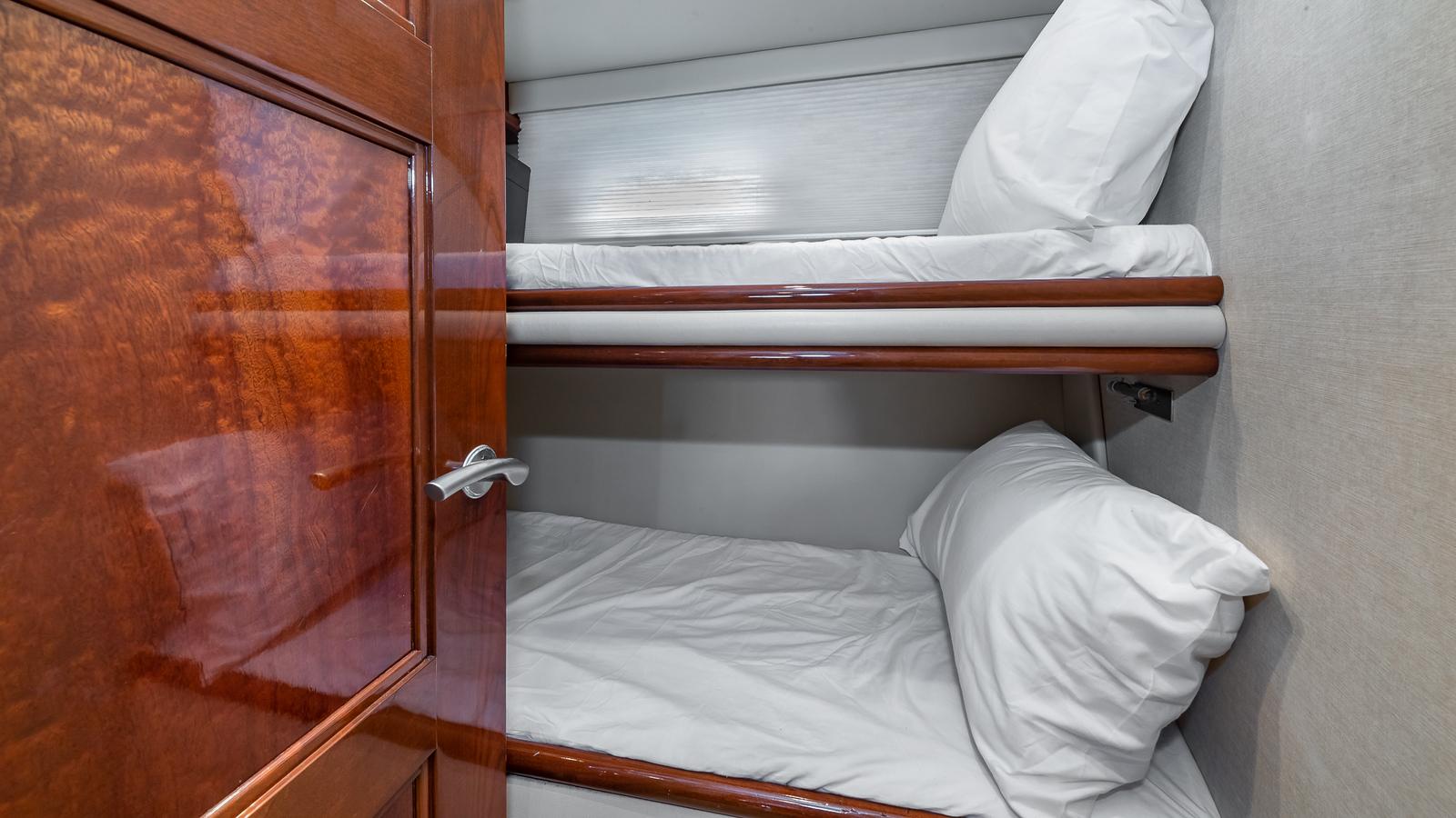 Marquis-59 2005-Next to Sell FL-US-Bunk beds in 2005 Marquis 59 yacht cabin with wooden door.-9654462 | Thumbnail