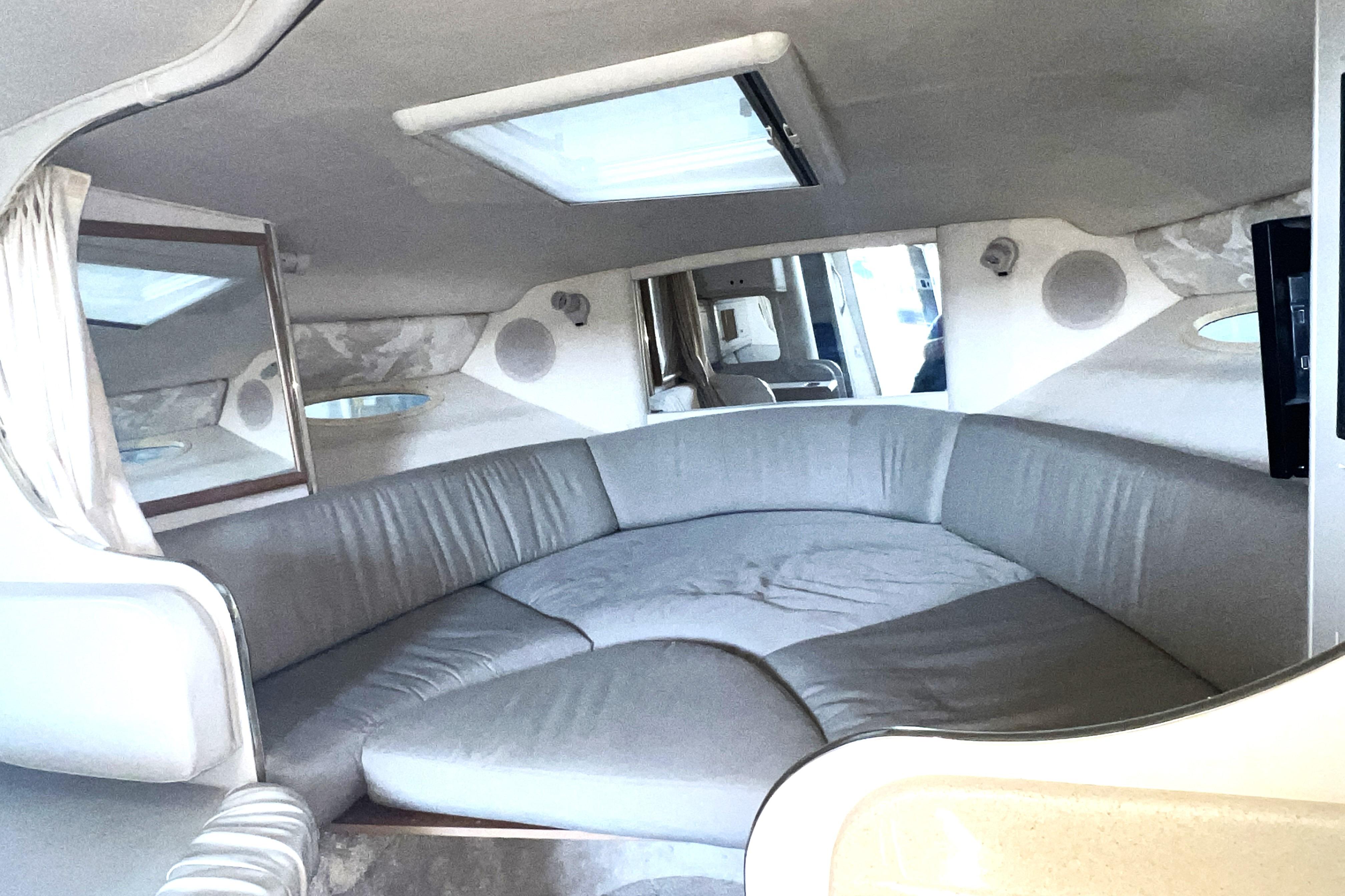 Interior of 1999 Sea Ray 290 Sundancer with spacious seating and modern design.