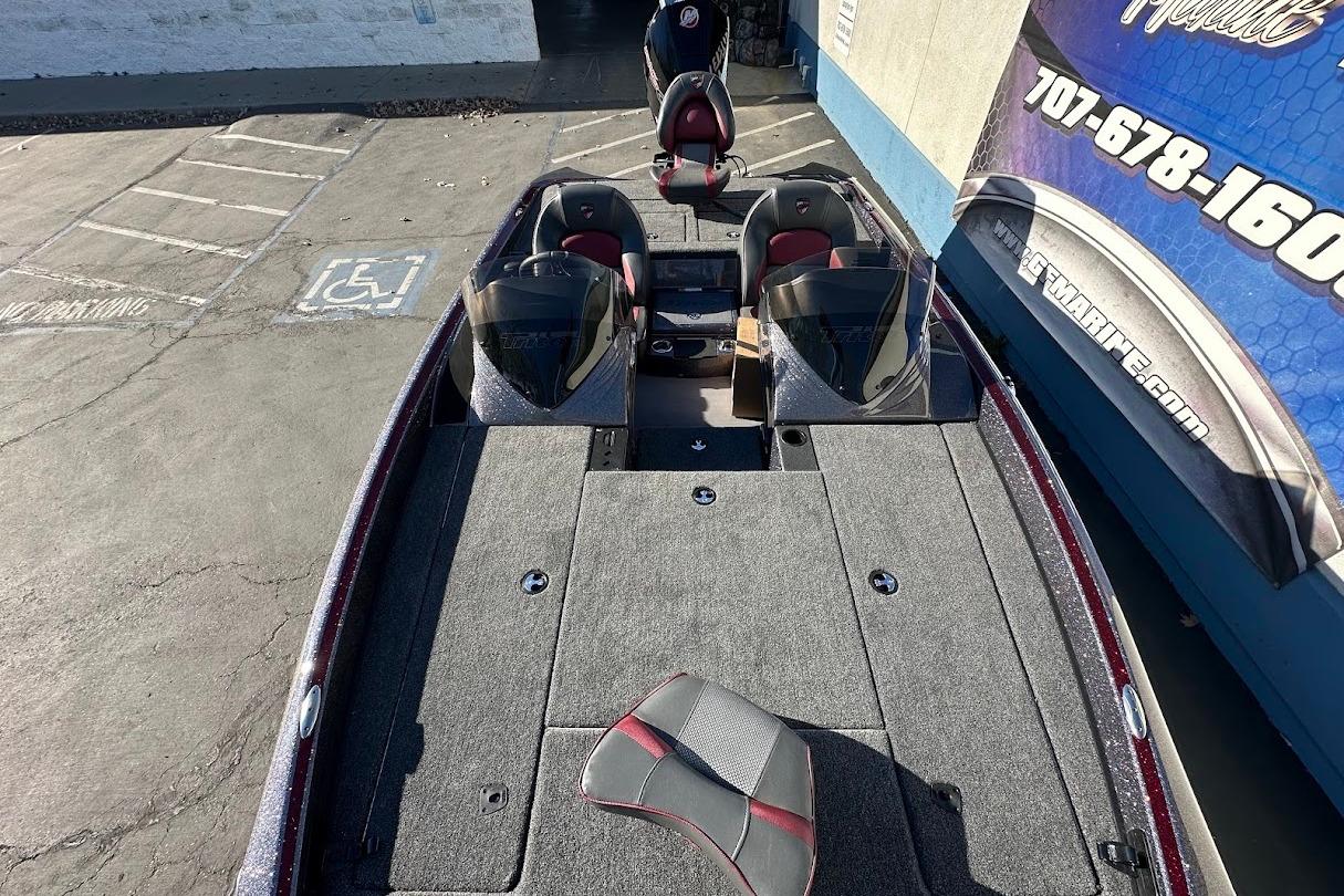 2026 Triton 18 TrX boat with dual consoles and spacious deck in a parking lot.