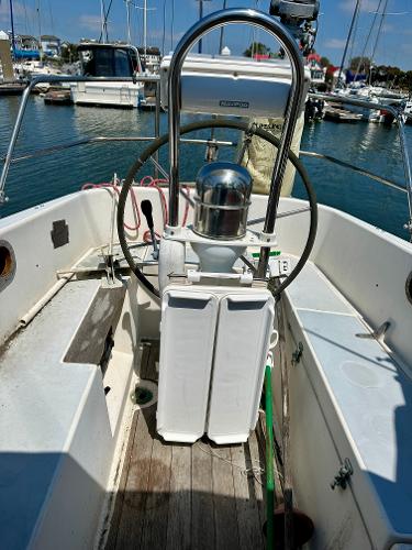 Cockpit of a 1990 Contessa 32 sailboat docked in a marina.