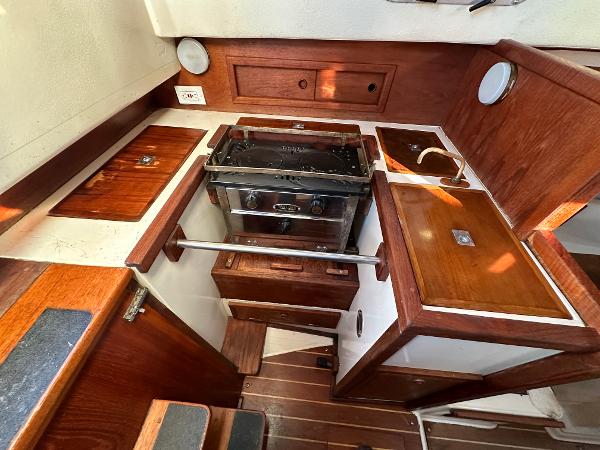 Interior of a 1990 Contessa 32 yacht with wooden fittings.