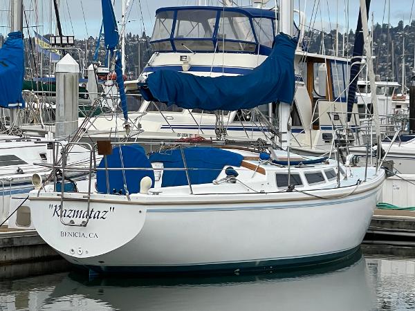 1984 Catalina 30 sailboat "Kizmetaz" docked in Benicia, CA marina.